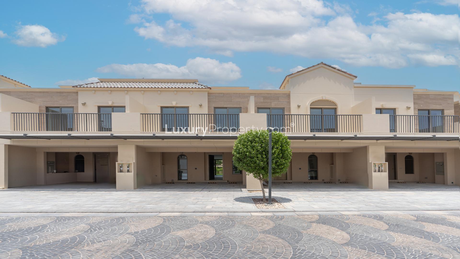 Modern kitchen interior with marble island in Jasmine Lane townhouse, Jumeirah Golf Estates