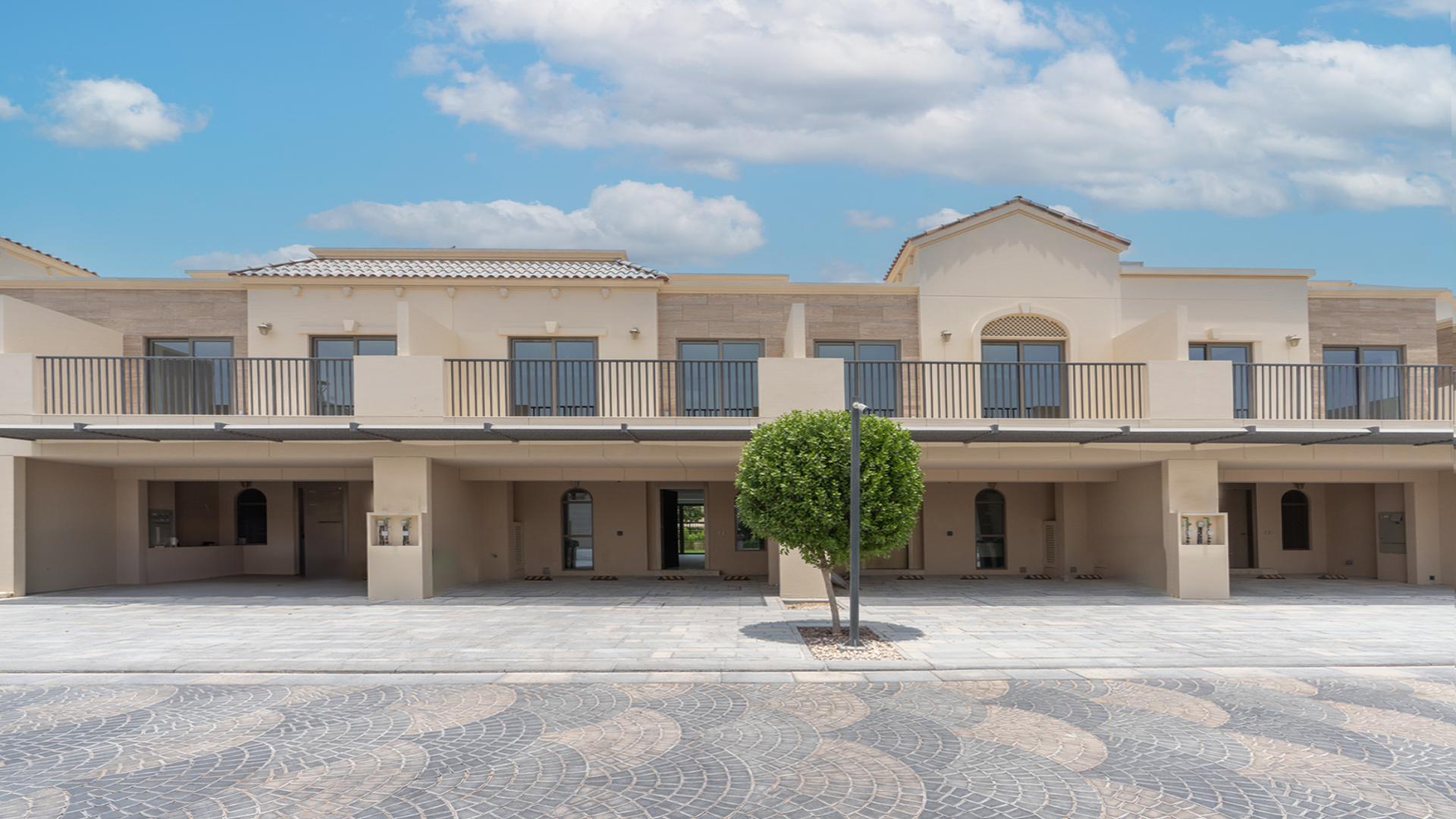 Modern kitchen interior with marble island in Jasmine Lane townhouse, Jumeirah Golf Estates