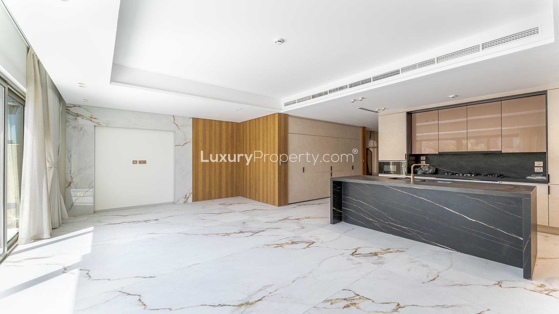 Bright living room with marble floors and garden view in Jasmine Lane townhouse