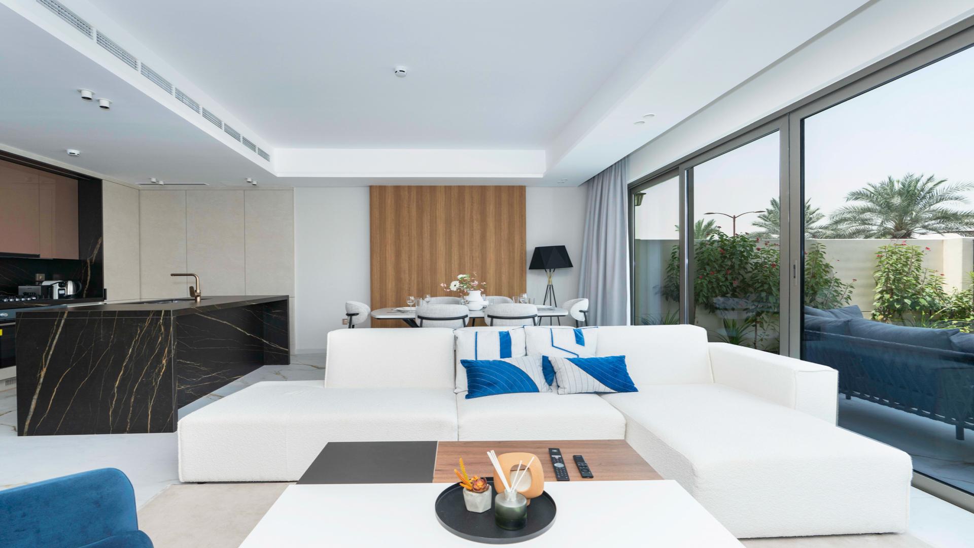 Modern townhouse exterior in Jasmine Lane, Jumeirah Golf Estates, available for rent