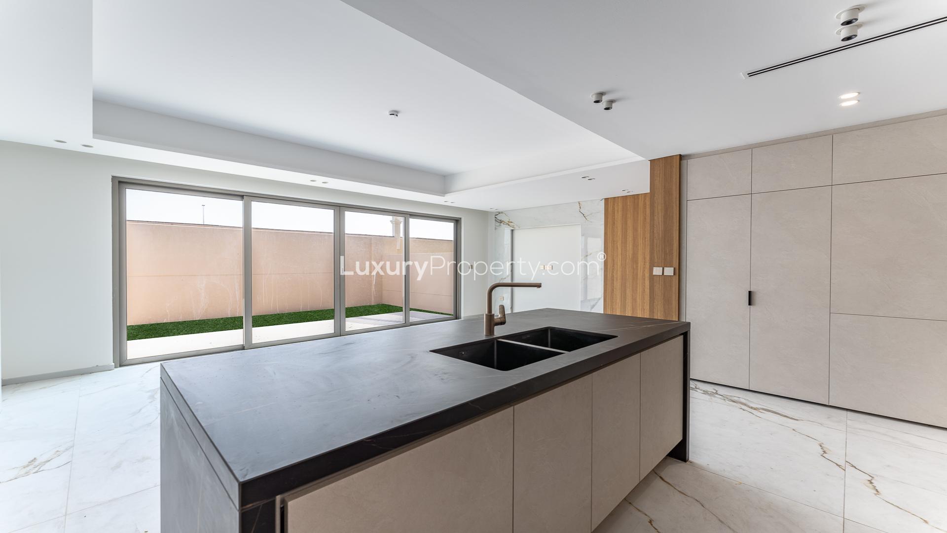 "Modern kitchen with marble floors in Jumeirah Golf Estates townhouse for rent, Jasmine Lane.",Brand new kitchen in Jumeirah Golf Estates townhouse, Jasmine Lane, for rent