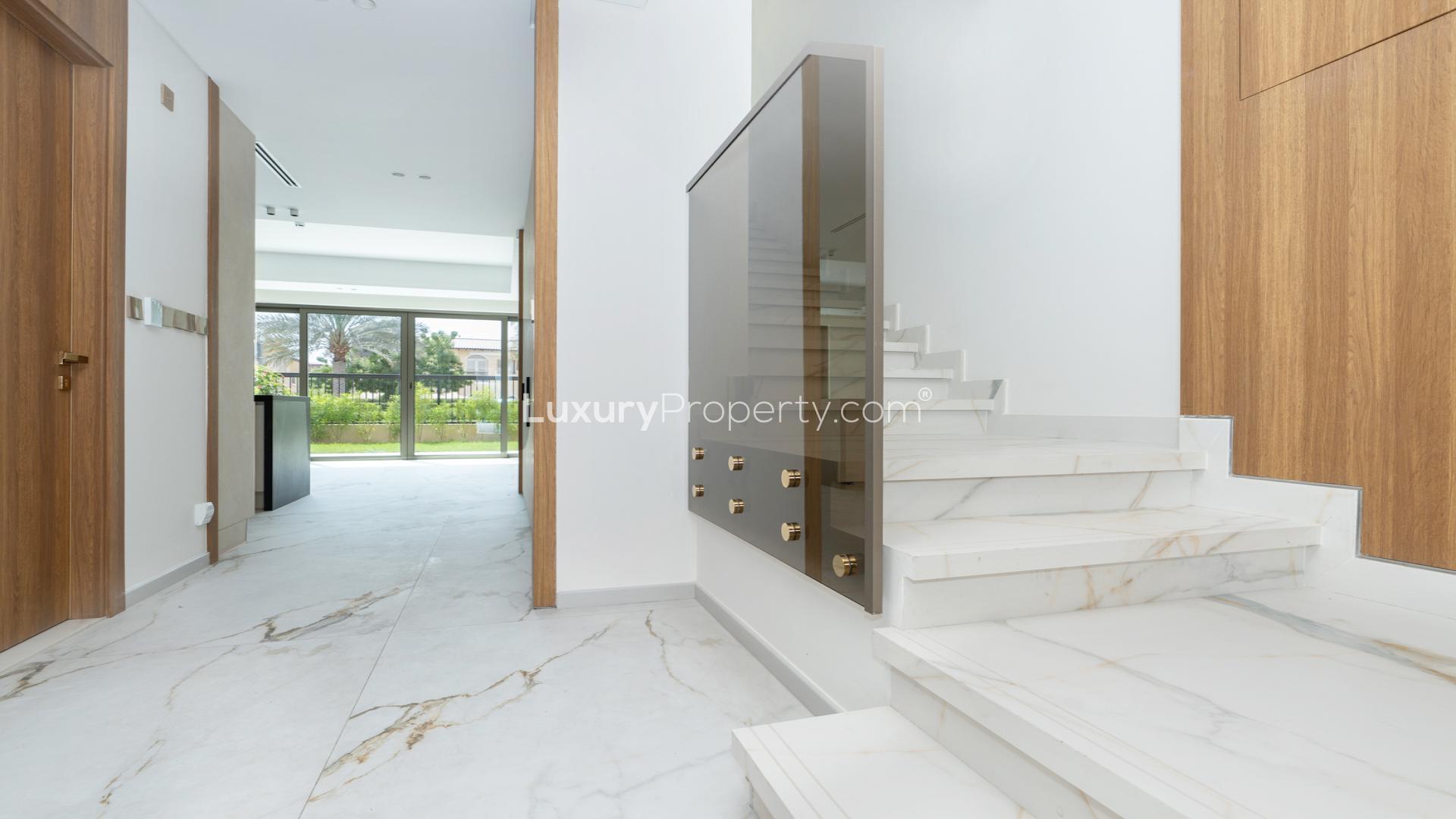 Interior of 3-bedroom townhouse at Jasmine Lane, Jumeirah Golf Estate, with garden view