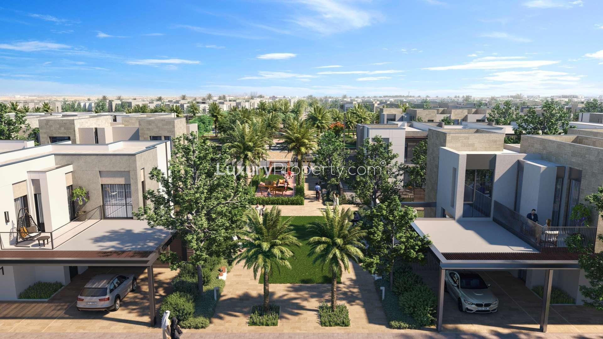 Modern 3-bed townhouse exterior in Arabian Ranches 3, Sun community, with garage and greenery