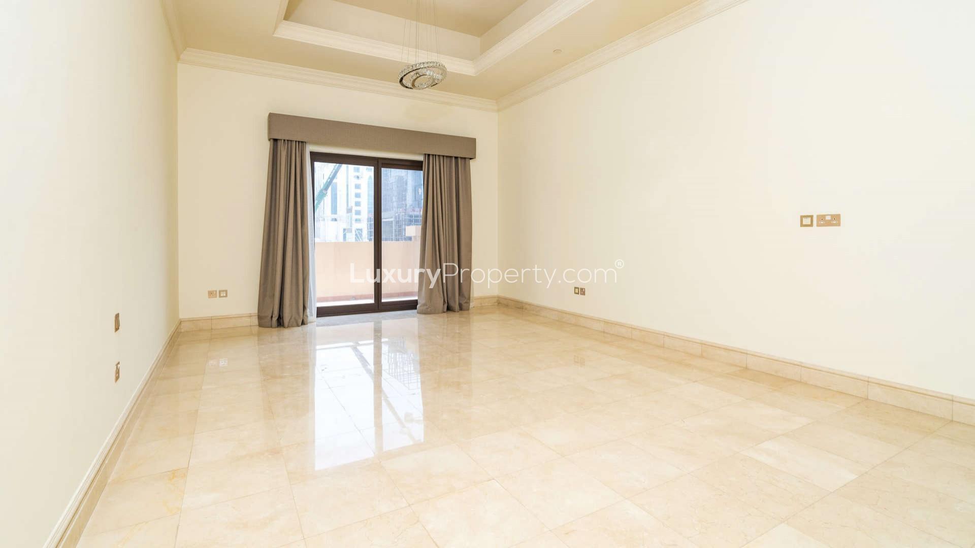 Empty living room with marble floors in Fairmont South Residence townhouse, Palm Jumeirah