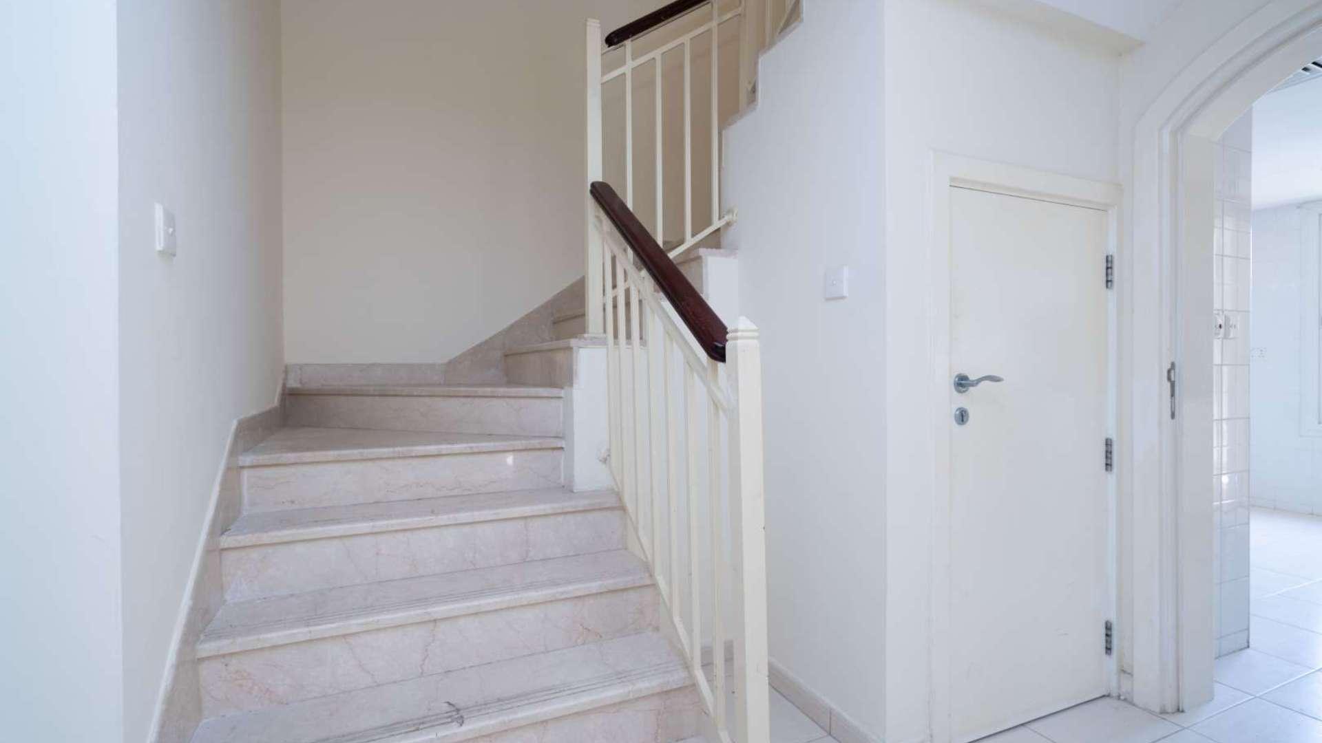 Modern kitchen with white cabinets in 3-bedroom townhouse for rent, The Springs