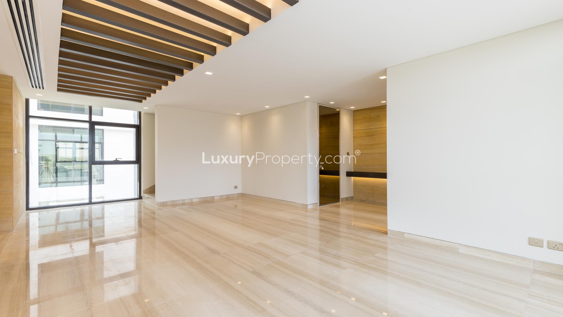 Modern kitchen in brand new Trevi villa, Damac Hills, featuring sleek appliances and cabinetry