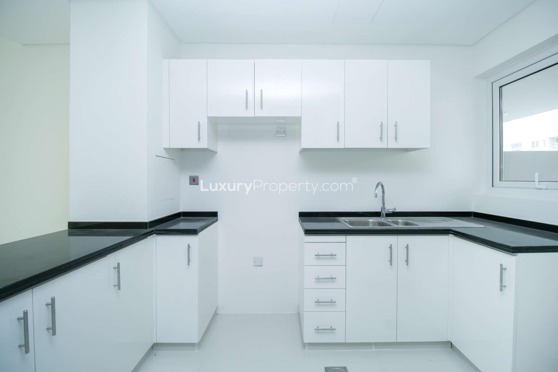 Bright open-plan kitchen and living area in three-bedroom townhouse, Damac Hills 2, Avencia