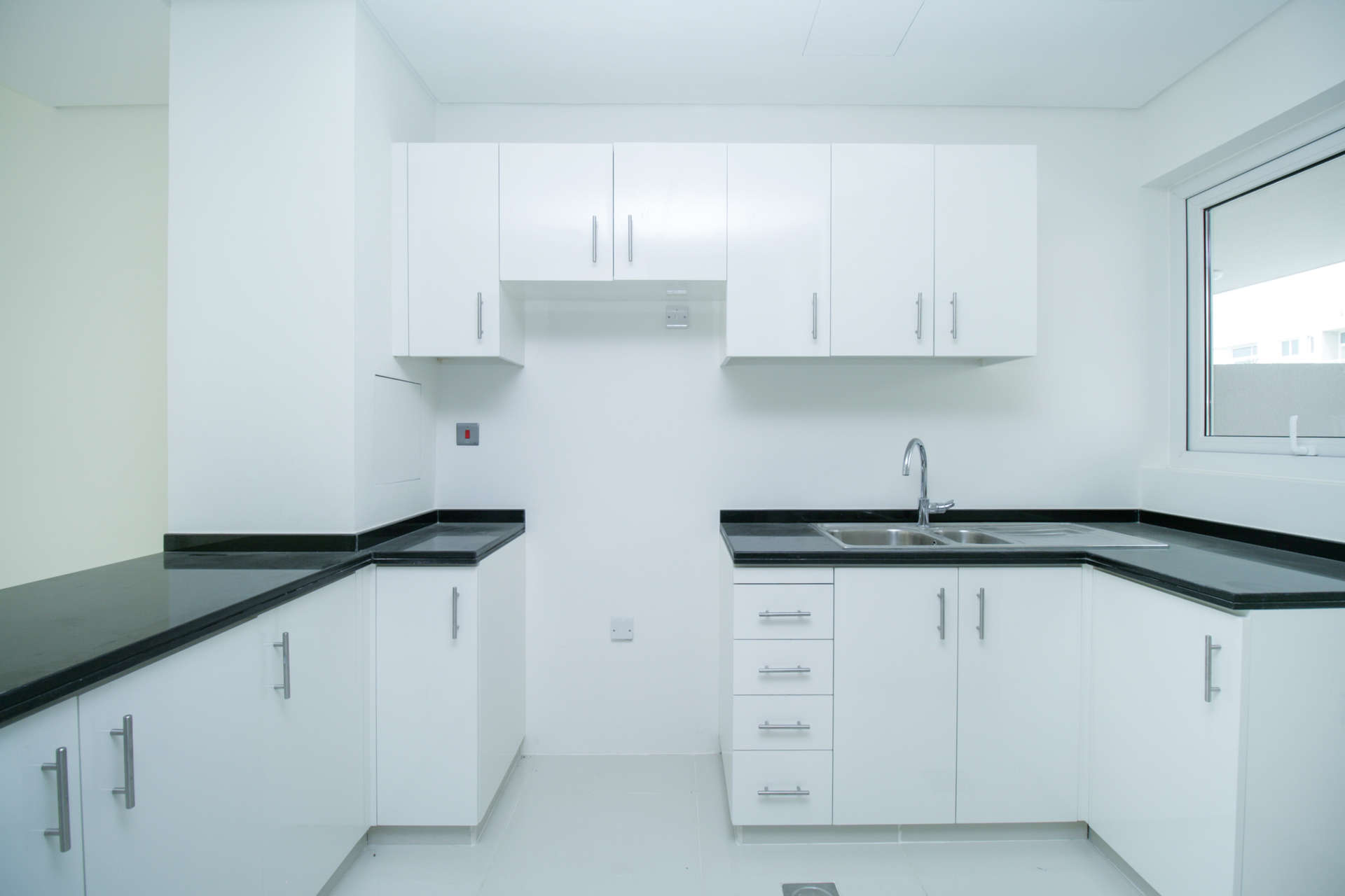 Bright open-plan kitchen and living area in three-bedroom townhouse, Damac Hills 2, Avencia