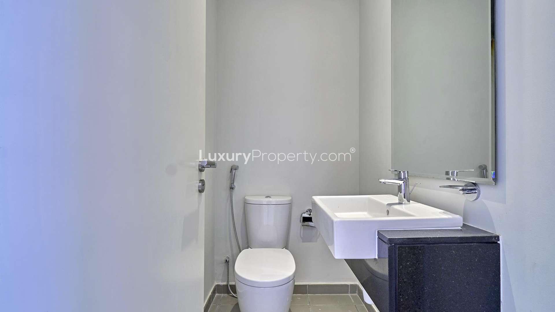 Modern kitchen and hallway in Dubailand townhouse for rent, Akoya Zinnia community