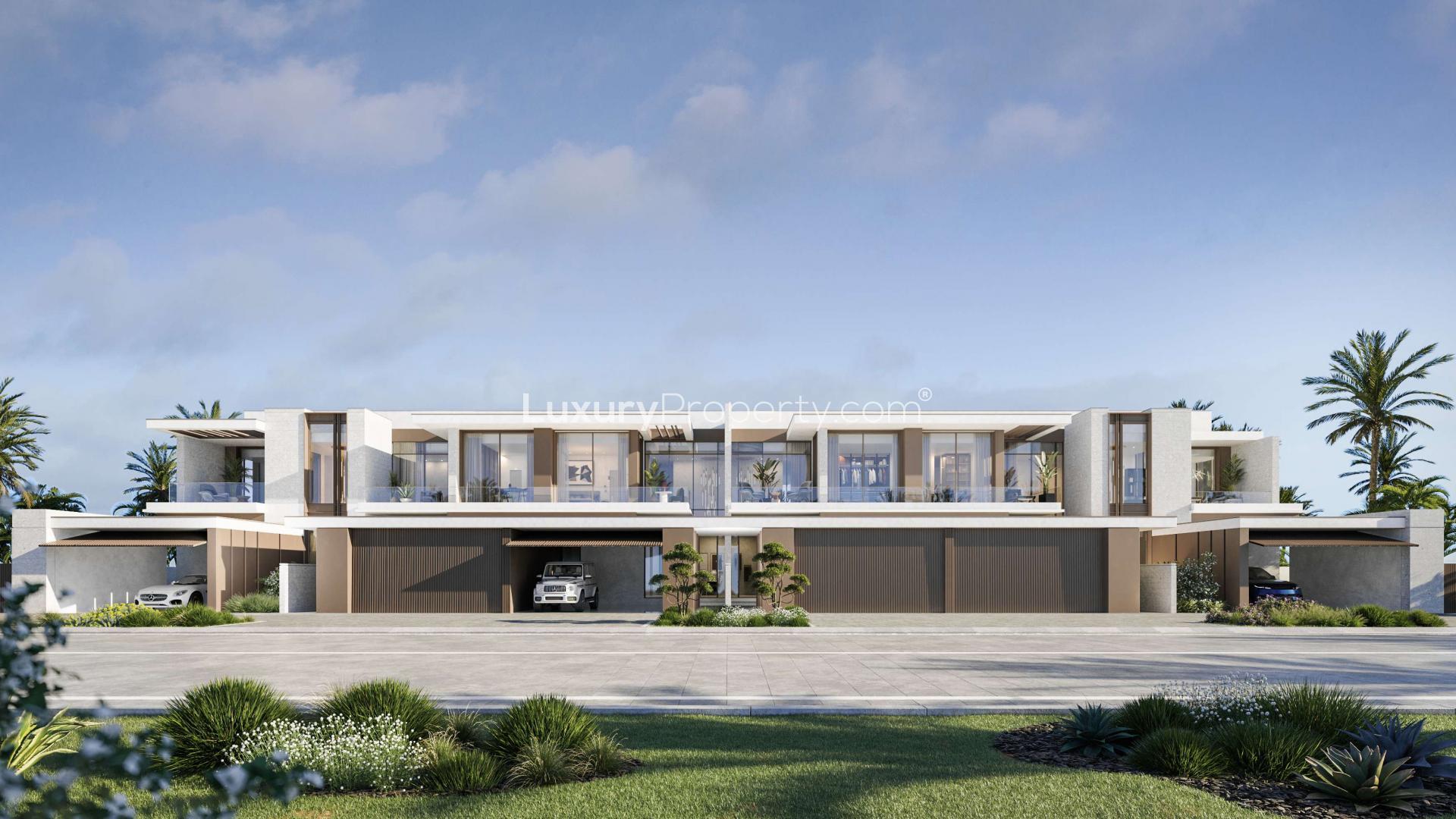 Elite 3-bedroom townhouses for sale on Dubai Islands, Deira, with modern design and lush surroundings