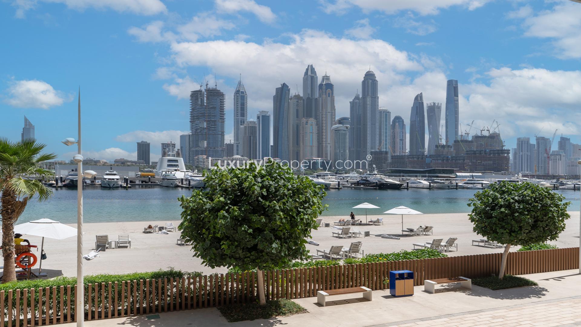 Empty living room with large windows, Emaar Beach Front townhouse for sale