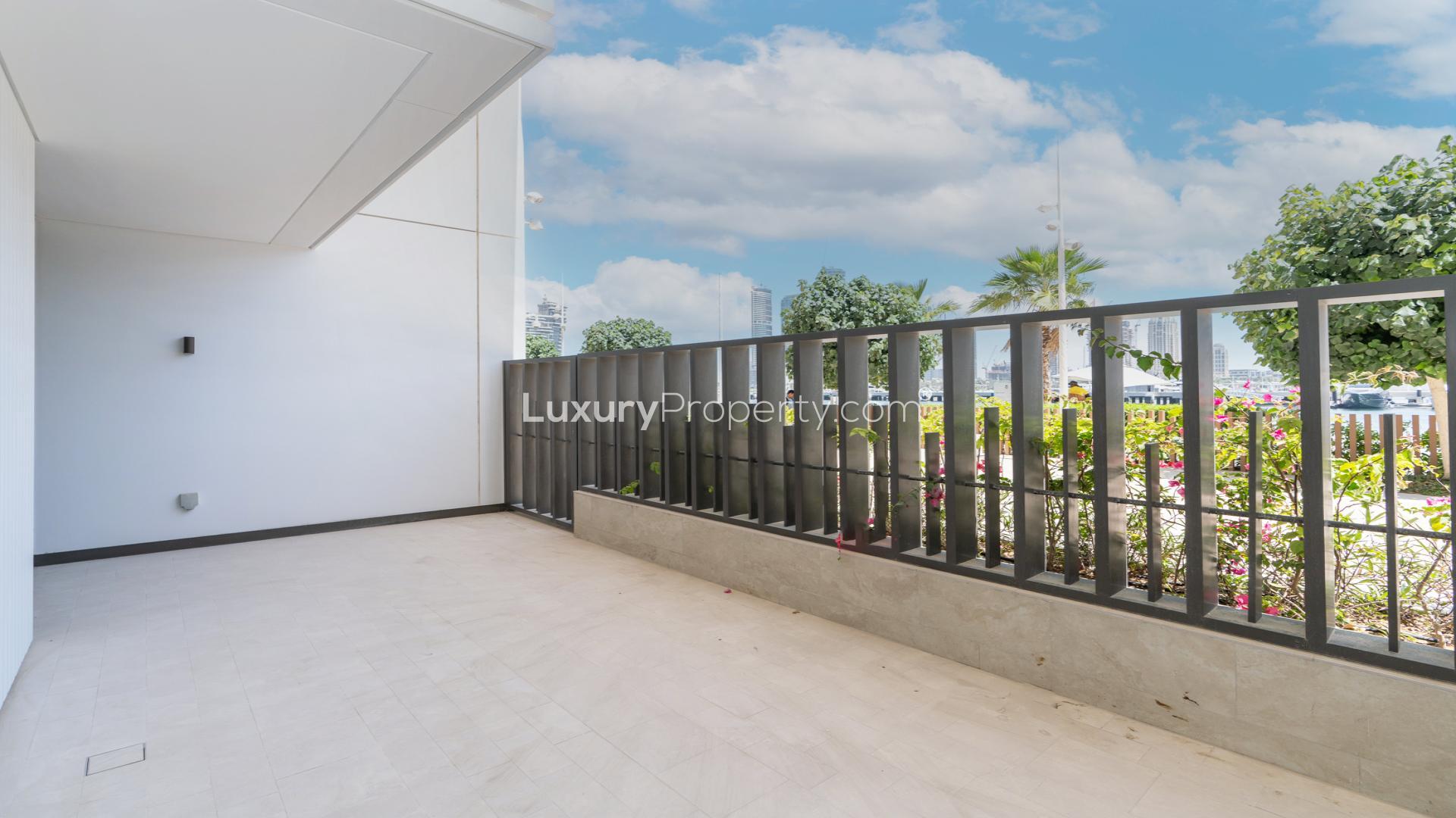 View from townhouse balcony at Sunrise Bay, Emaar Beach Front, overlooking private beach and skyline