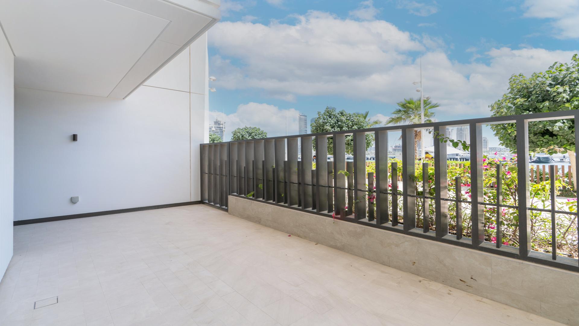 View from townhouse balcony at Sunrise Bay, Emaar Beach Front, overlooking private beach and skyline