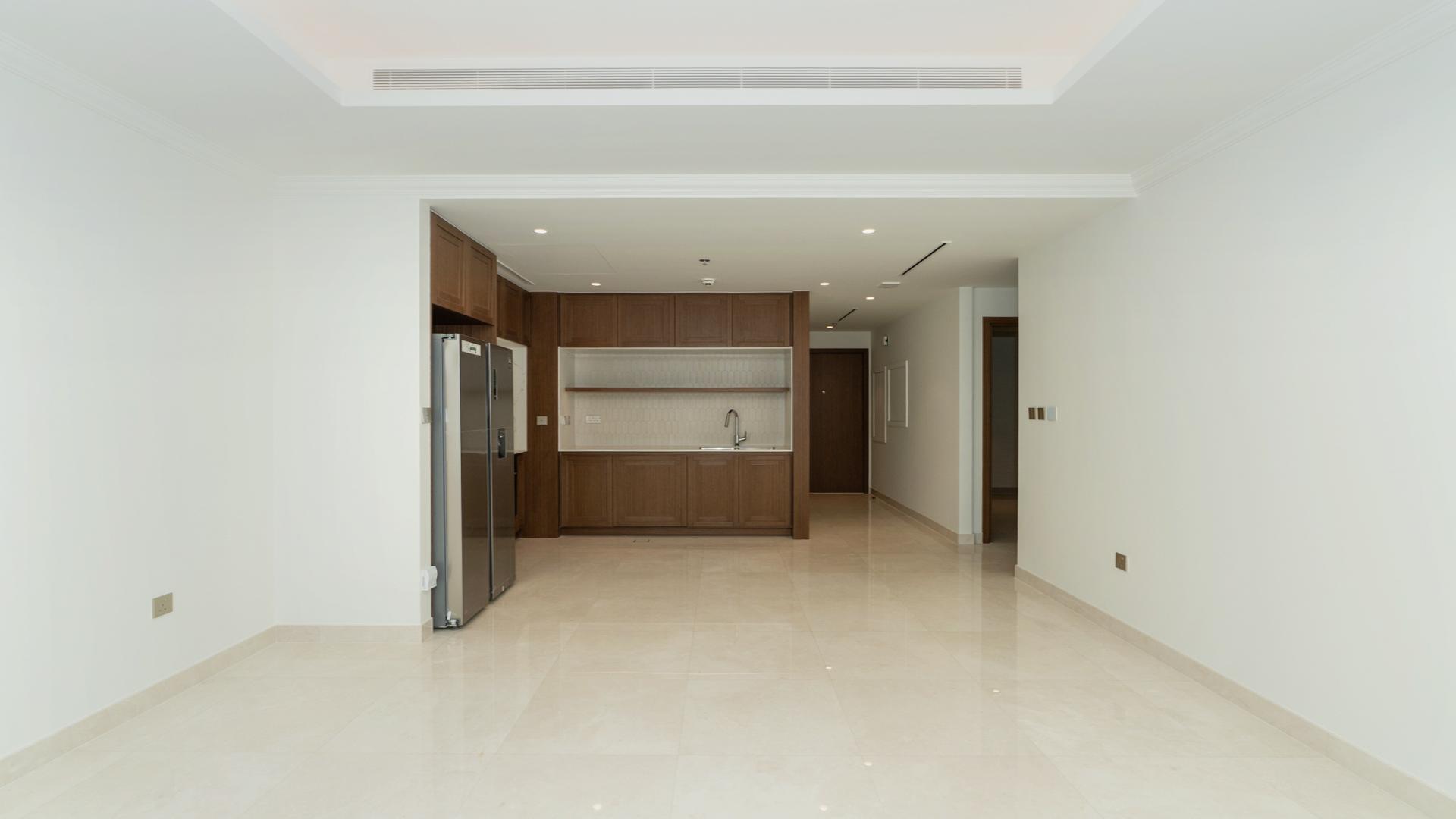 Empty living room with large windows, Emaar Beach Front townhouse for sale