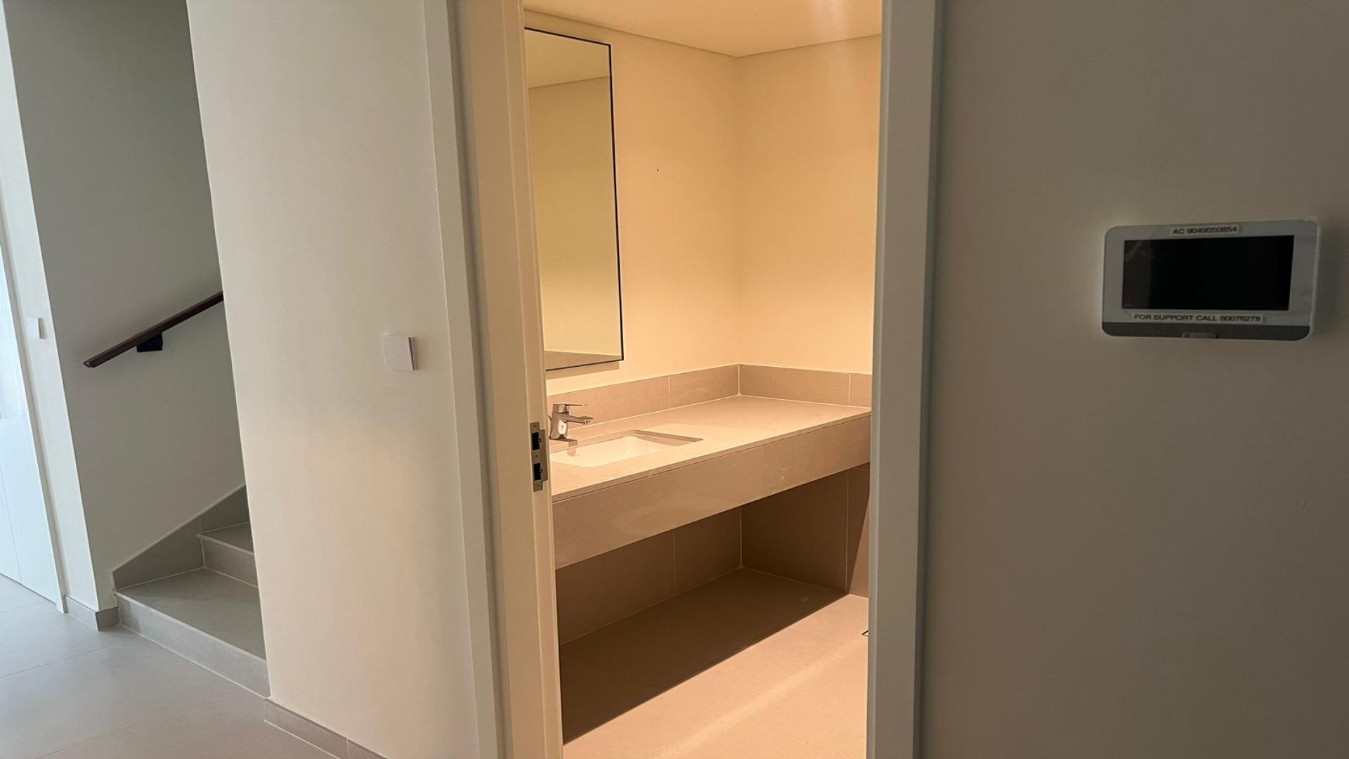 Modern townhouse interior with sliding glass doors, Emaar Greenview Villas, Madinat Al Mataar