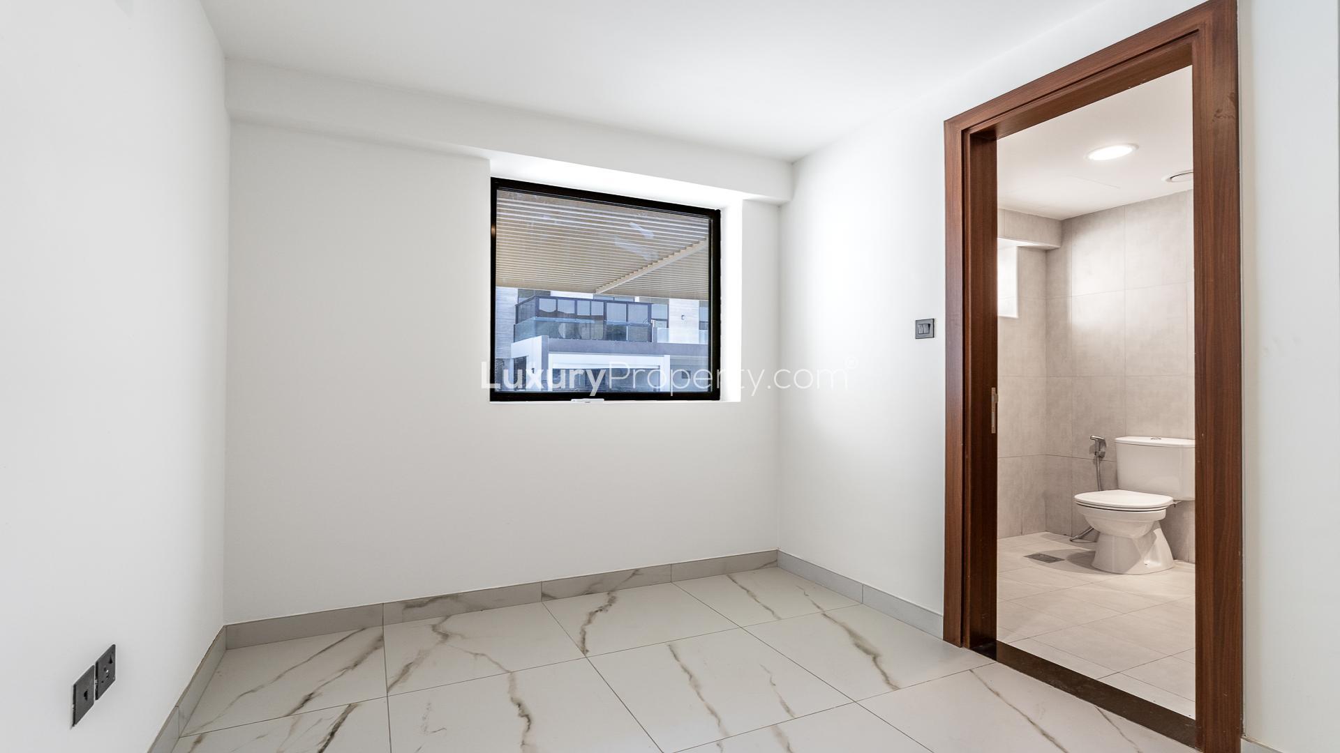 Bright interior of Meydan townhouse with large windows and modern marble flooring