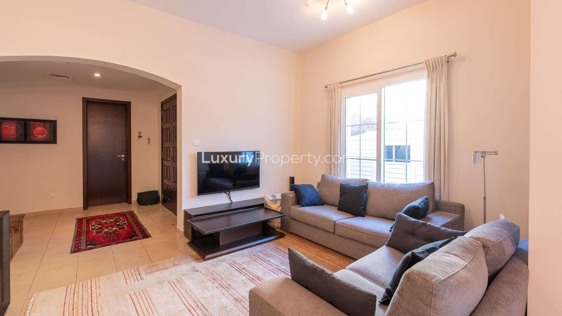Living room view of Al Reem Villa, Arabian Ranches with garden access, LP06842
