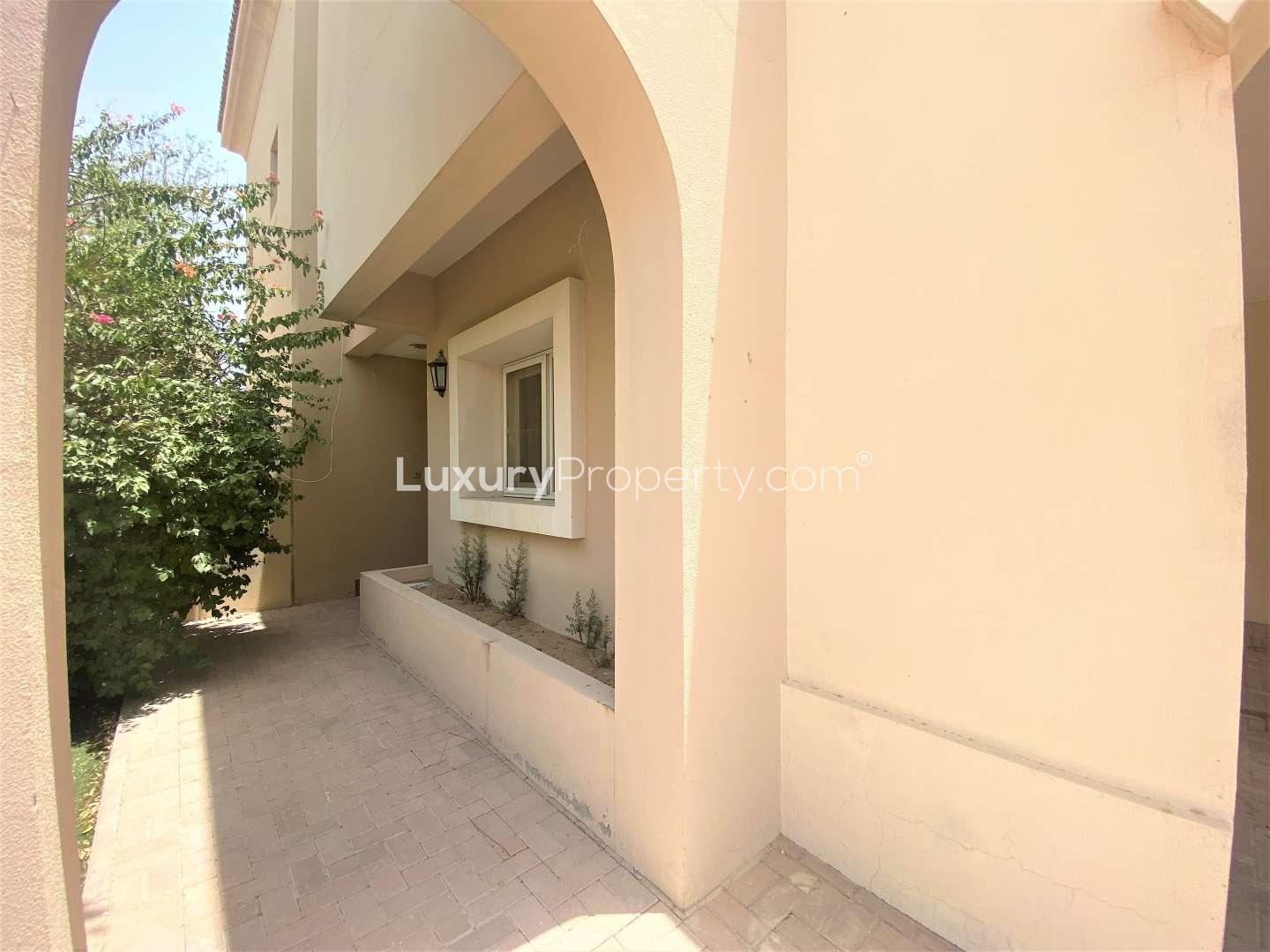 3-bedroom villa exterior in Al Reem 3, Arabian Ranches, featuring spacious driveway and greenery