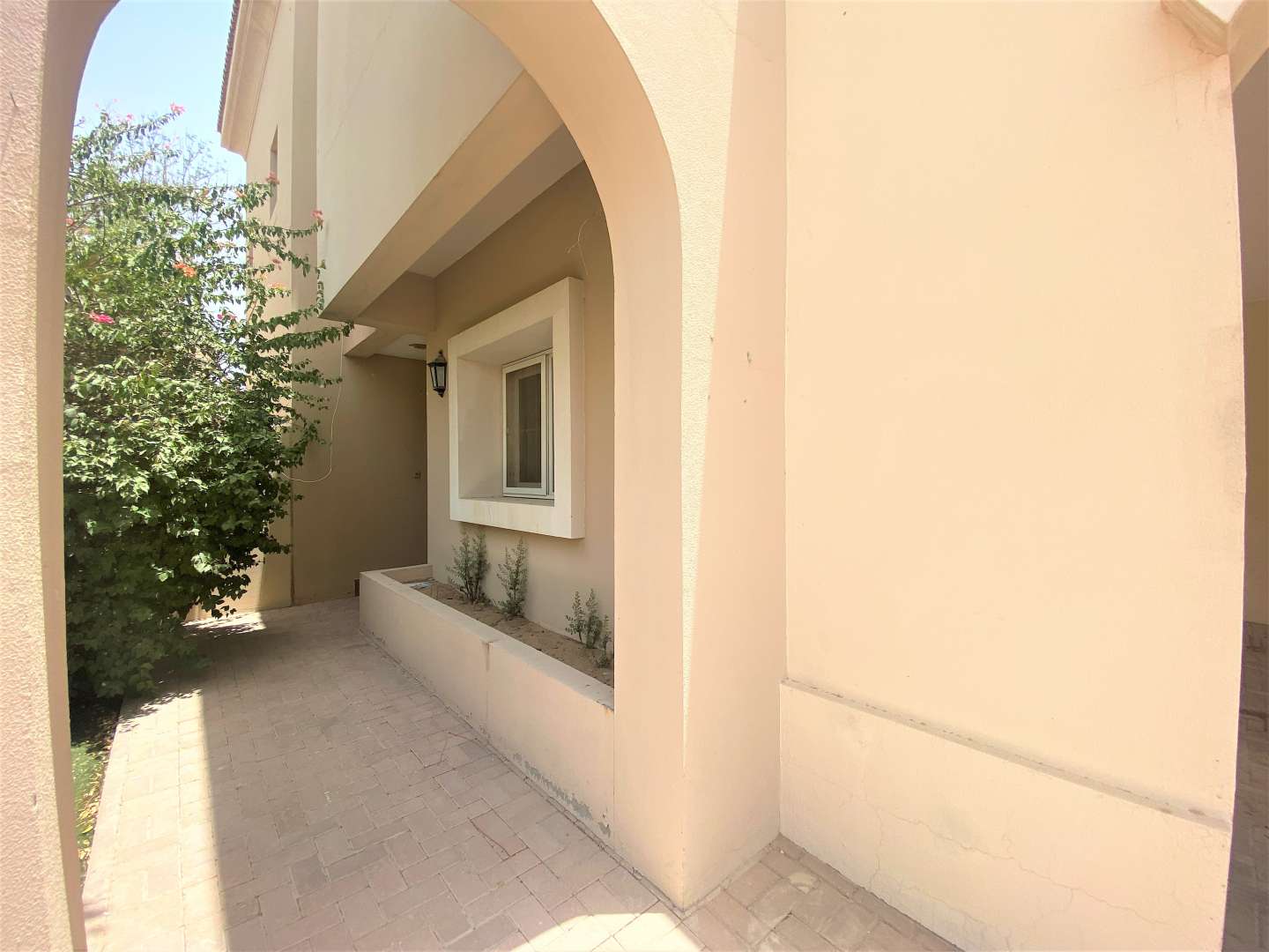 3-bedroom villa exterior in Al Reem 3, Arabian Ranches, featuring spacious driveway and greenery