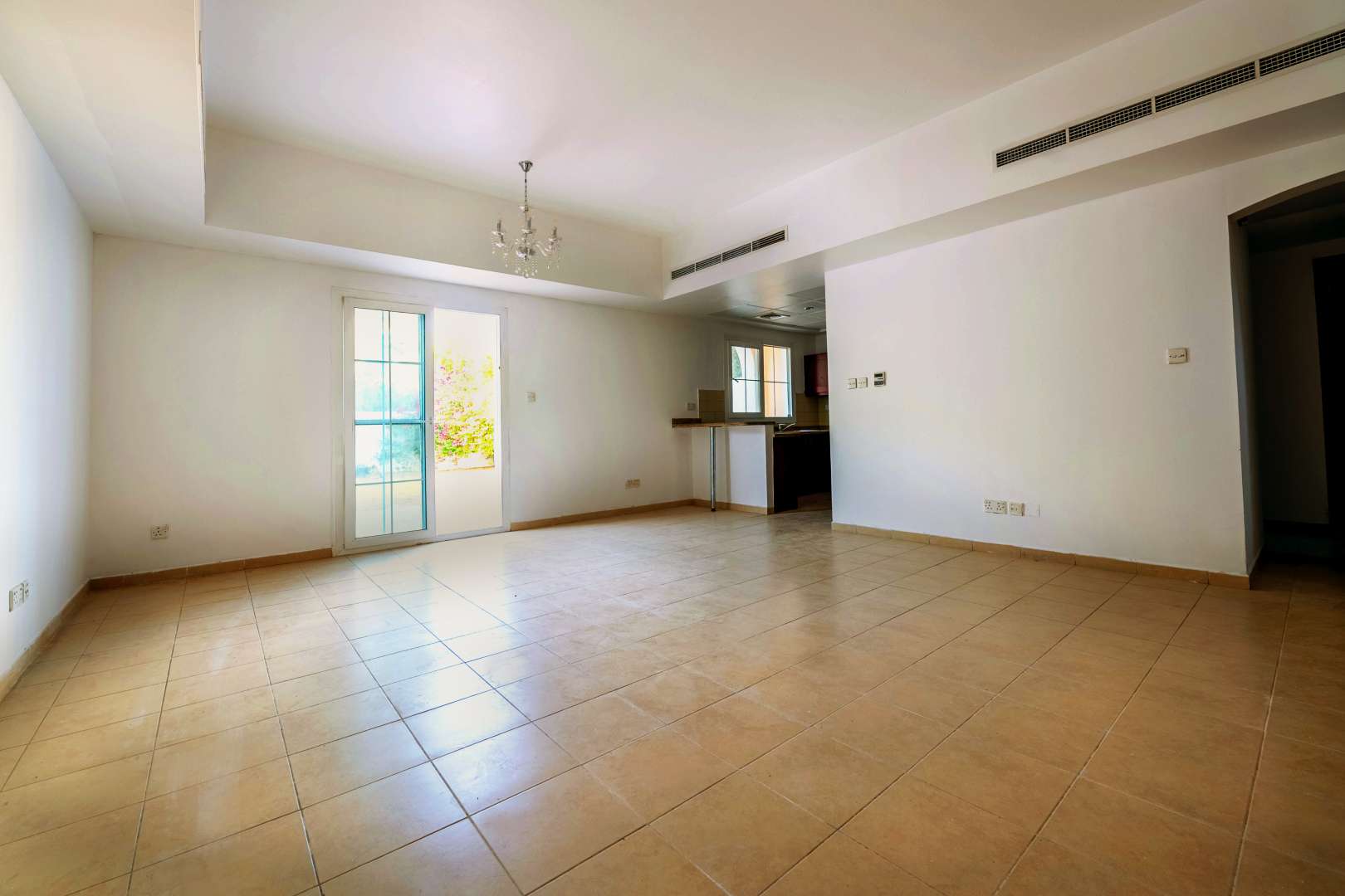Empty room with window in Al Reem townhouse, Arabian Ranches, available for sale