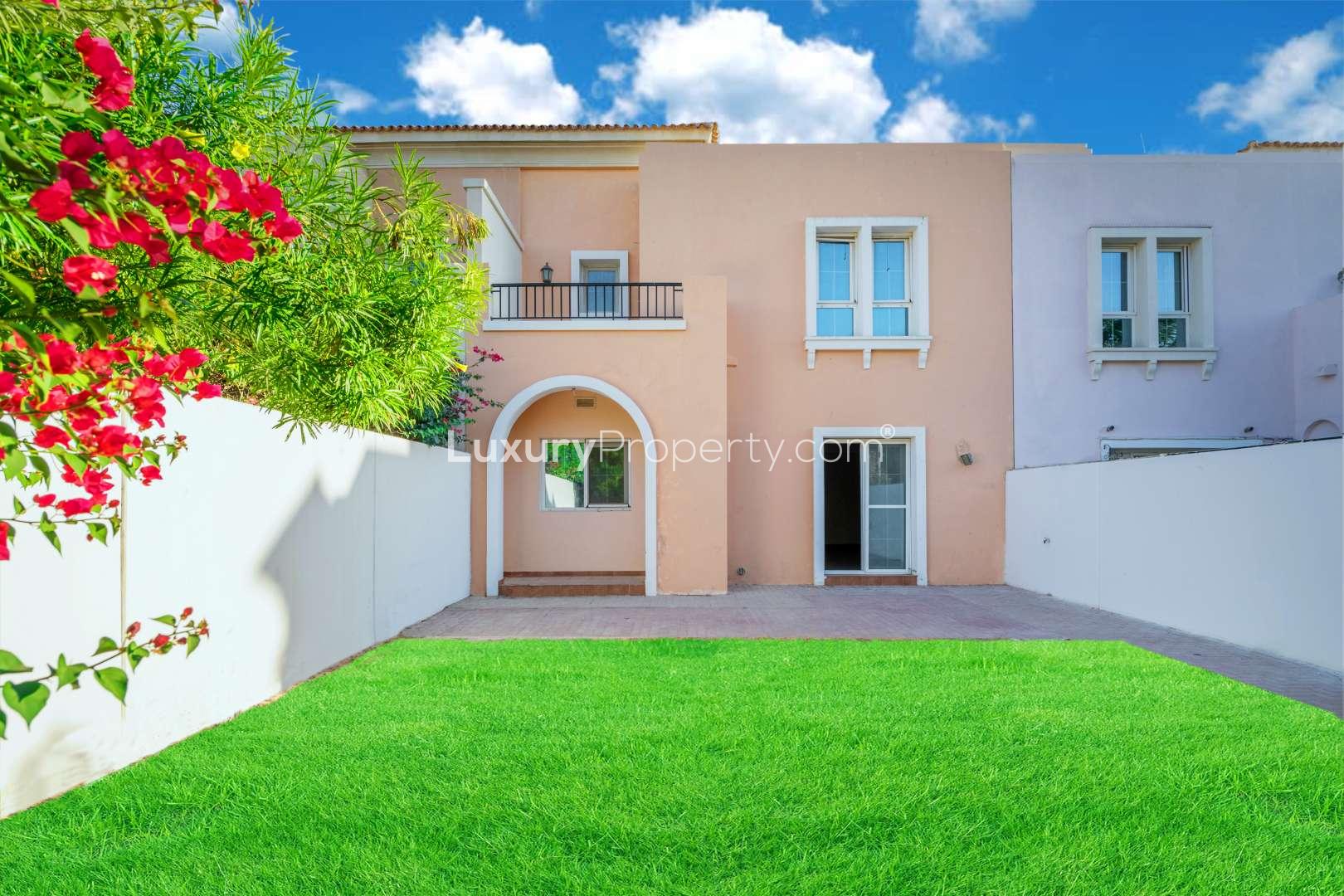 Spacious living area in Al Reem townhouse, Arabian Ranches, featuring tiled flooring and natural light