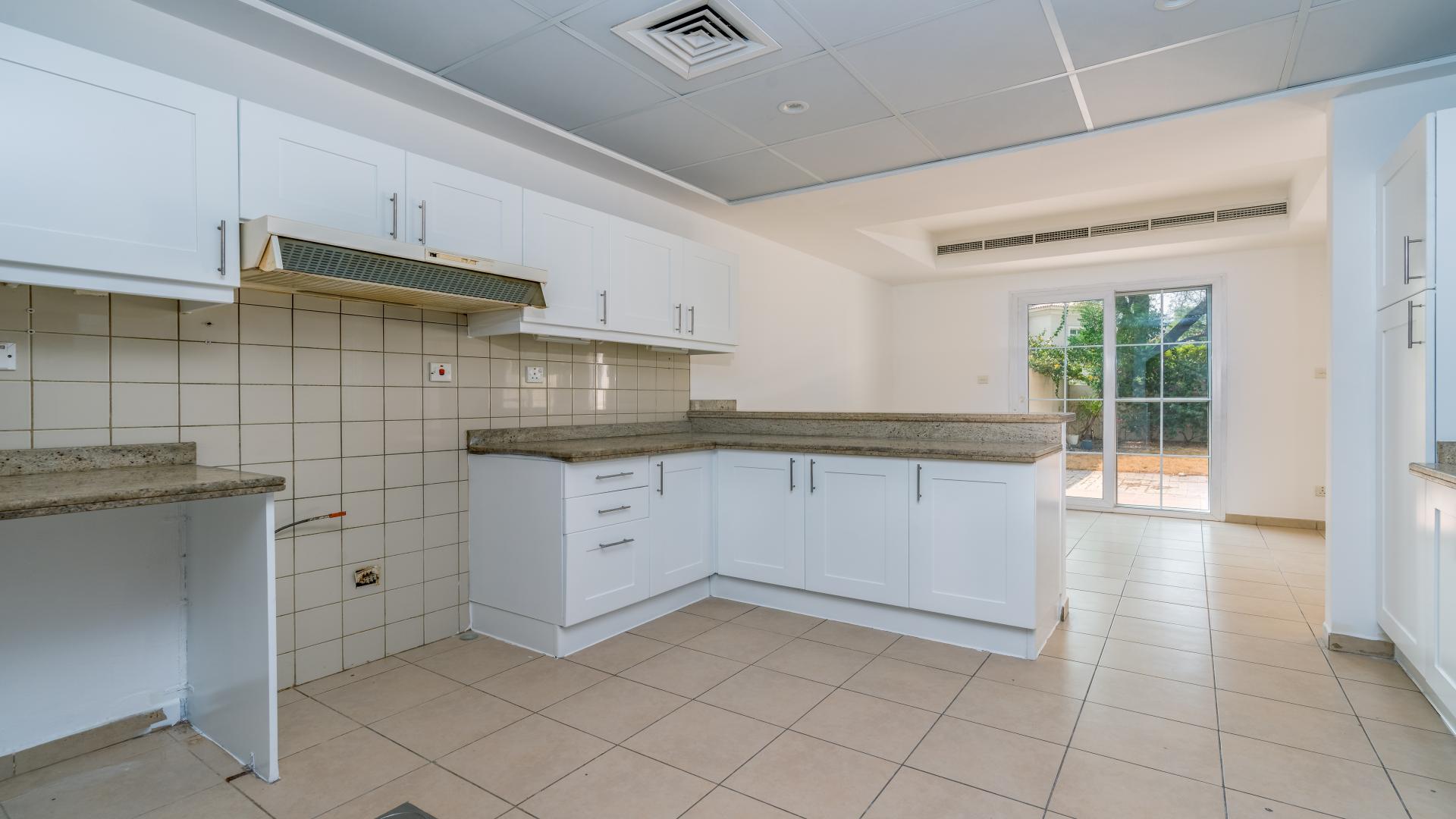 Exterior view of 3-bedroom villa in Al Reem, Arabian Ranches with patio and garden area