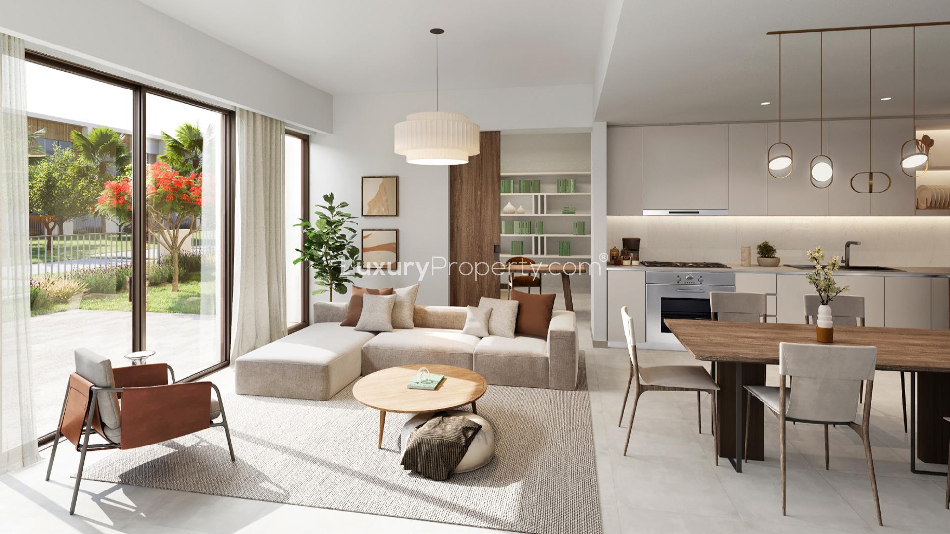 Contemporary dining area with modern staircase in Orania townhouse, The Valley, Dubai