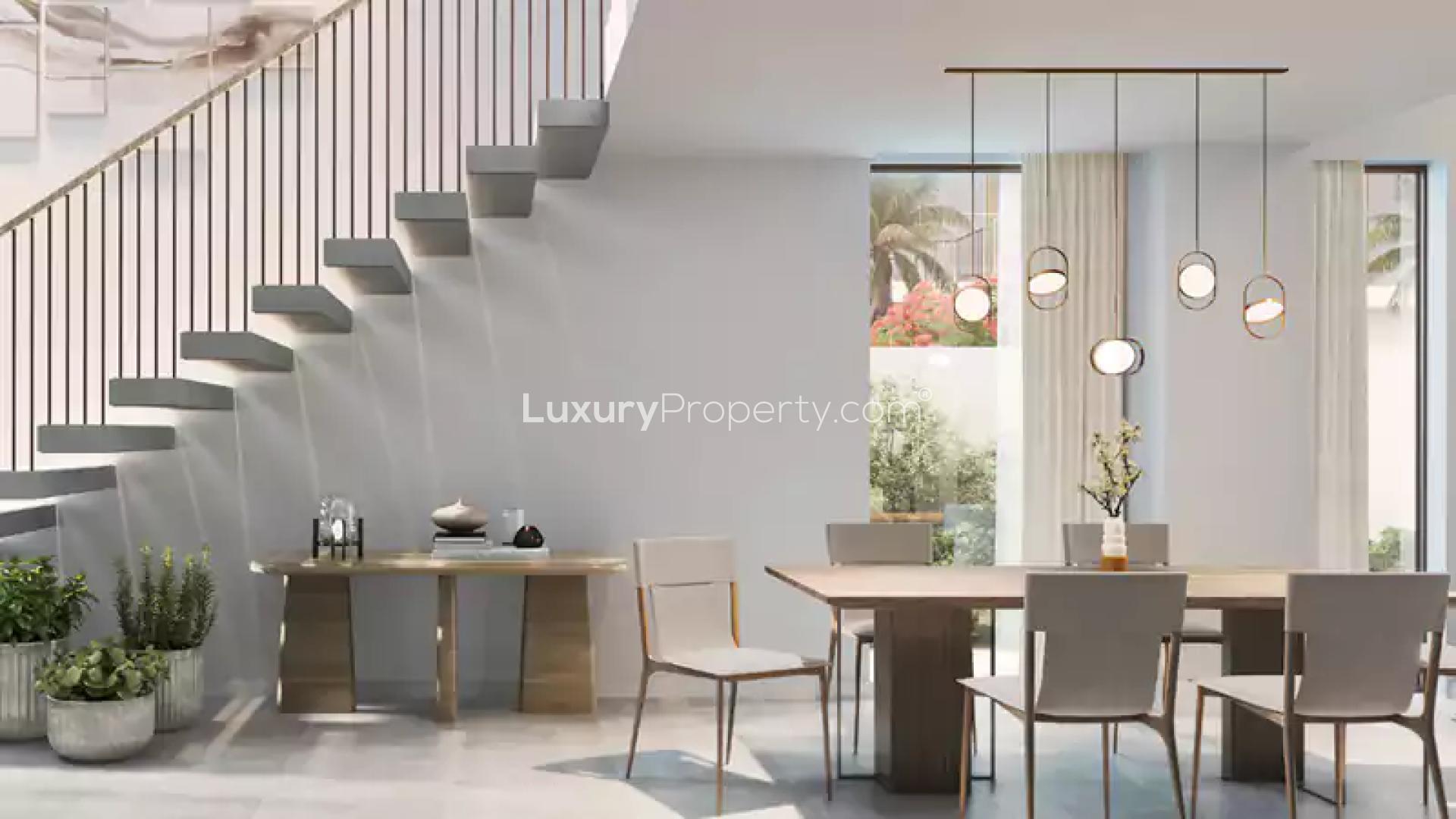 Modern living room in Orania townhouse, The Valley, with large windows and stylish decor