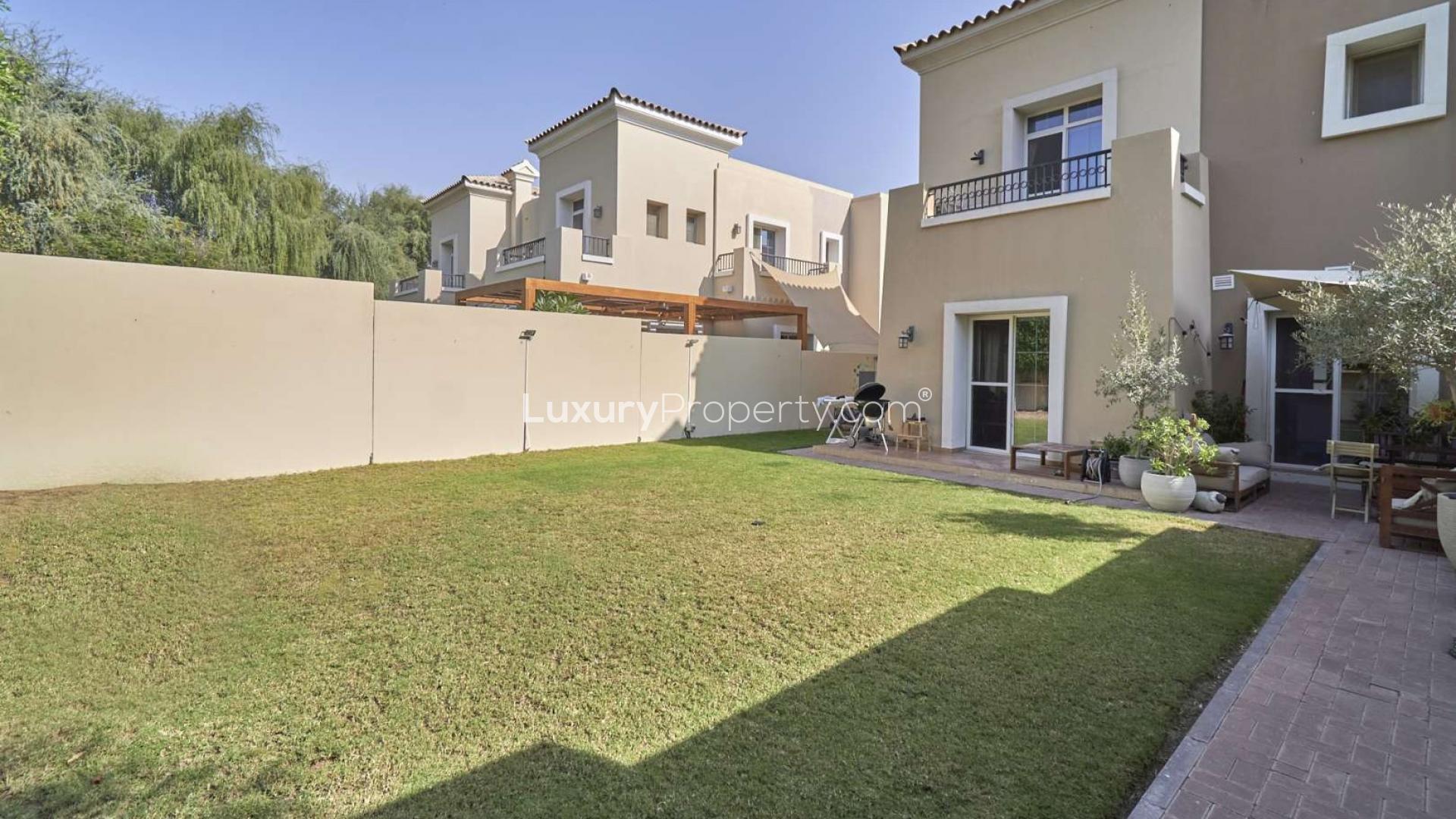 Exterior view of three-bedroom townhouse with garden in Alma, Arabian Ranches for sale