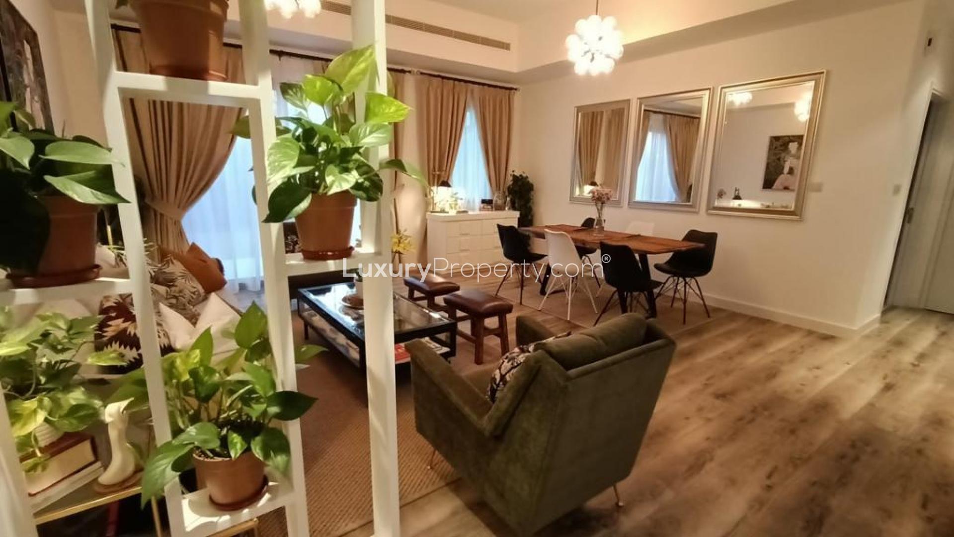 Modern living and dining area in Mira townhouse, Reem community, featuring stylish decor