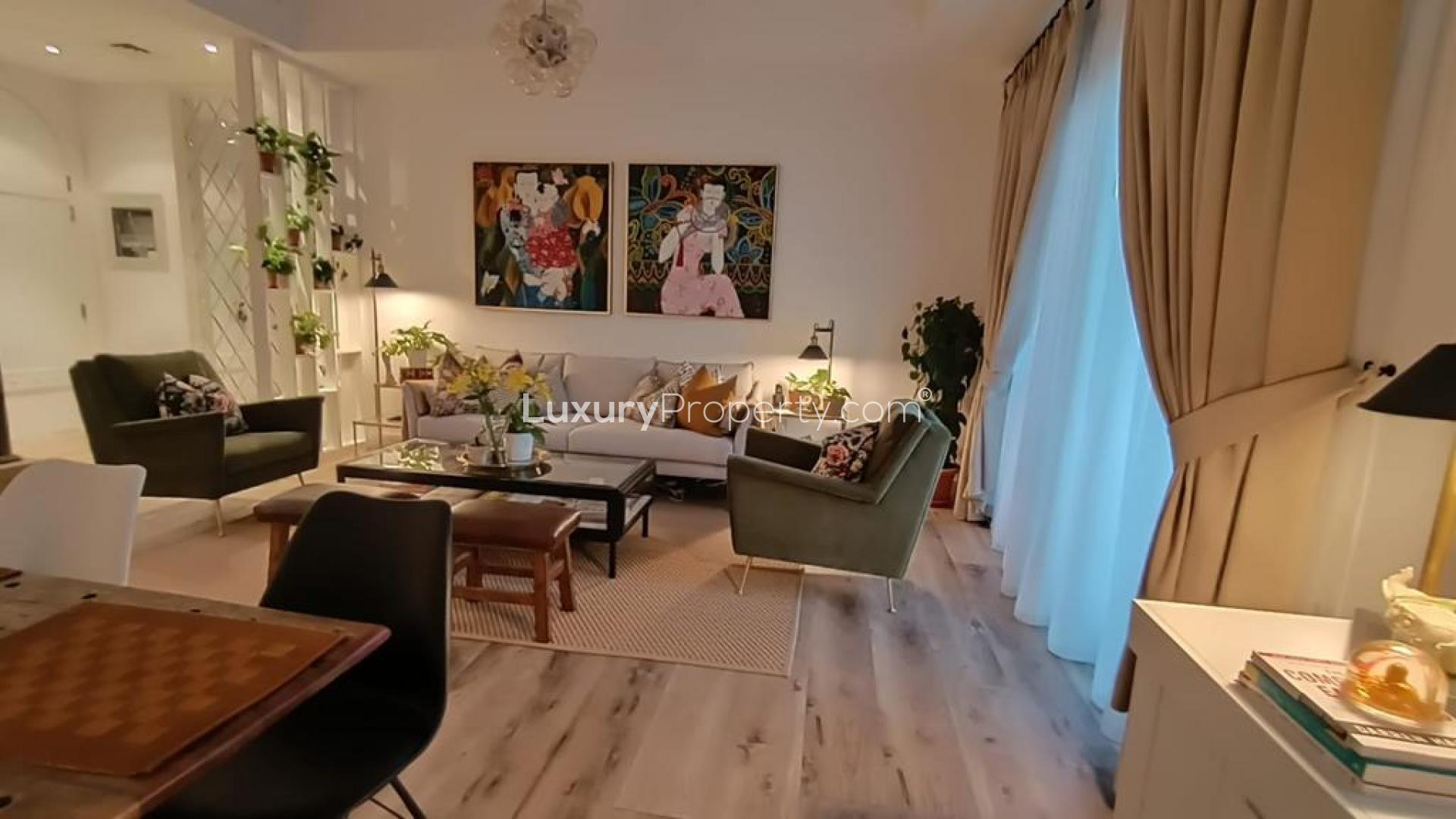 Modern living room and dining area in Mira townhouse, Reem community. Cozy and elegant design