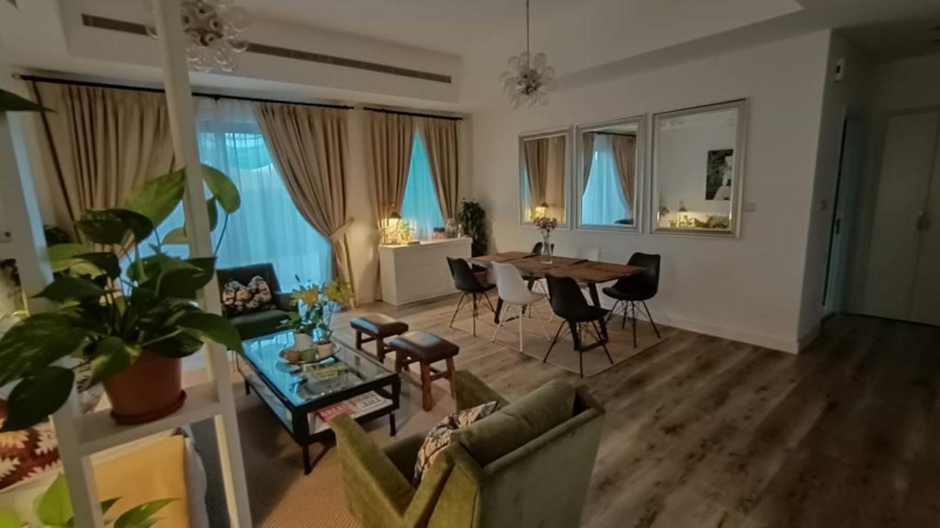 Modern living and dining area in Mira townhouse, Reem community, spacious and elegantly furnished