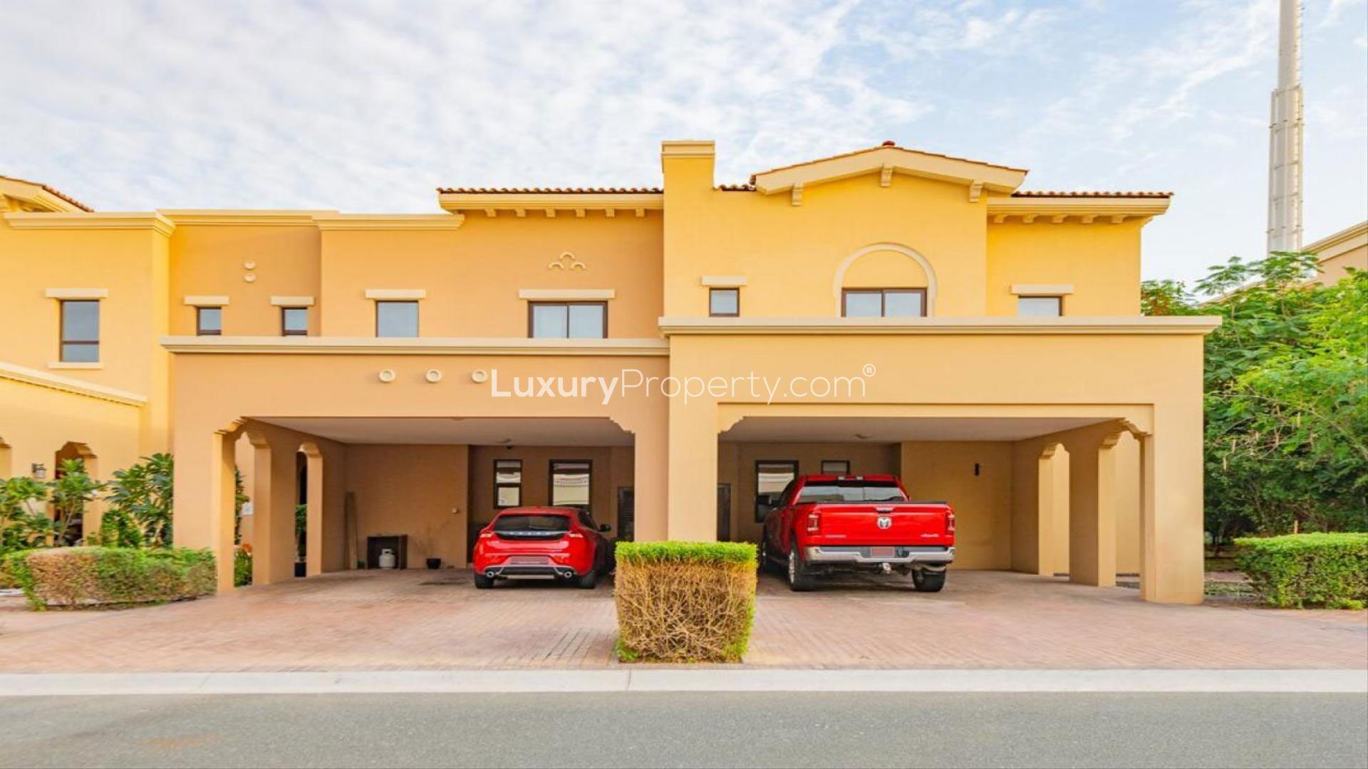 Elegant living room in 3-bed Mira 2 villa, featuring garden view and modern decor
