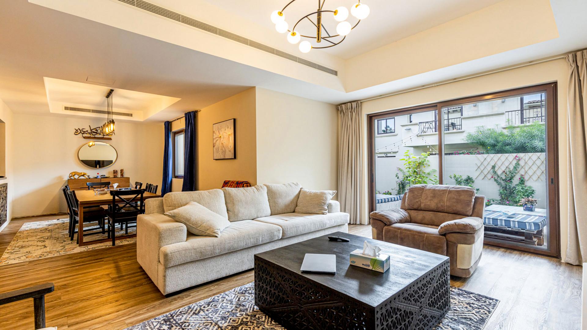 Townhouse exterior with patio and garden in Mira, Reem community, three bedrooms, for sale