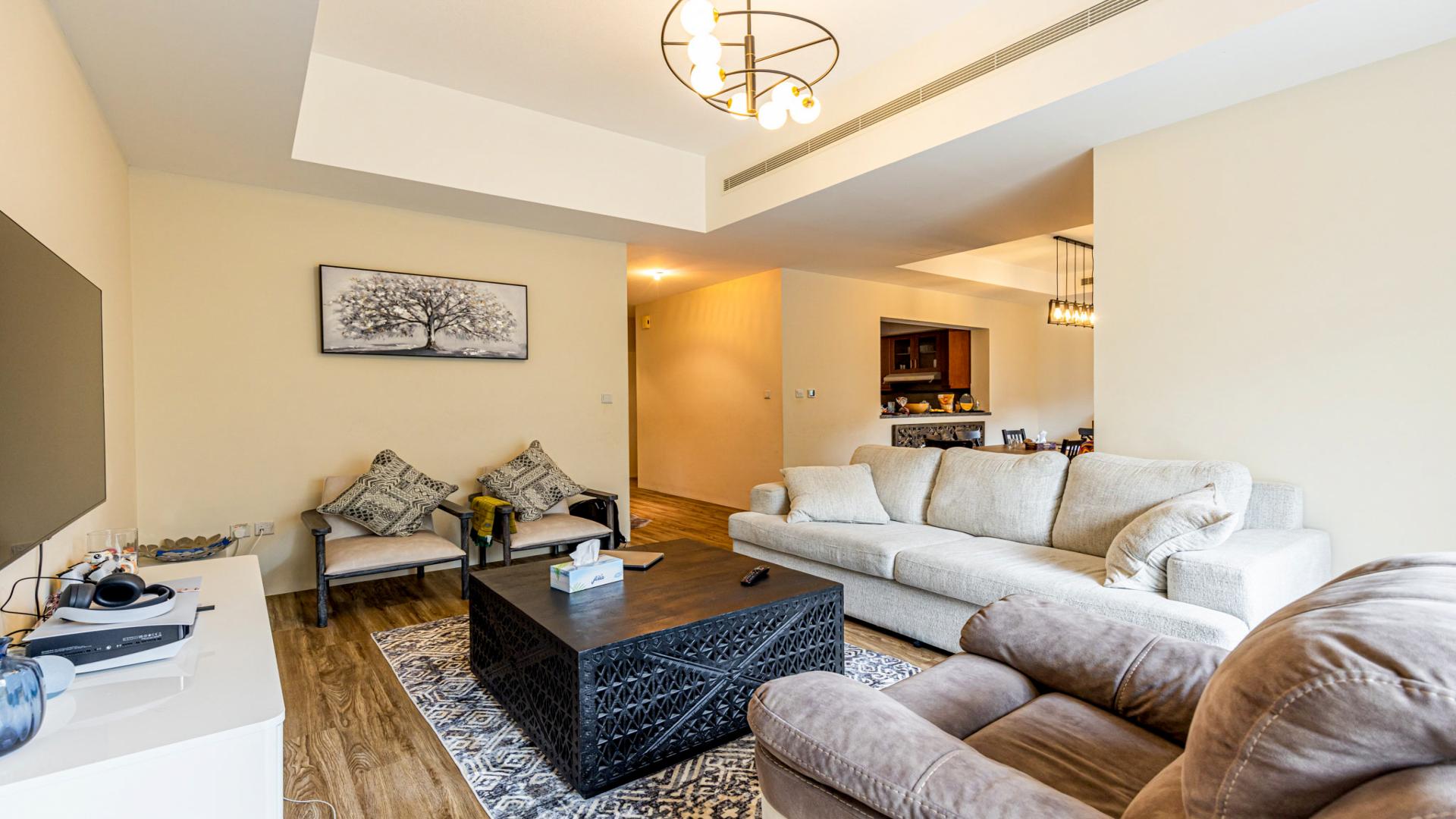 Townhouse garden with seating area and greenery in Mira, Reem community, Dubai