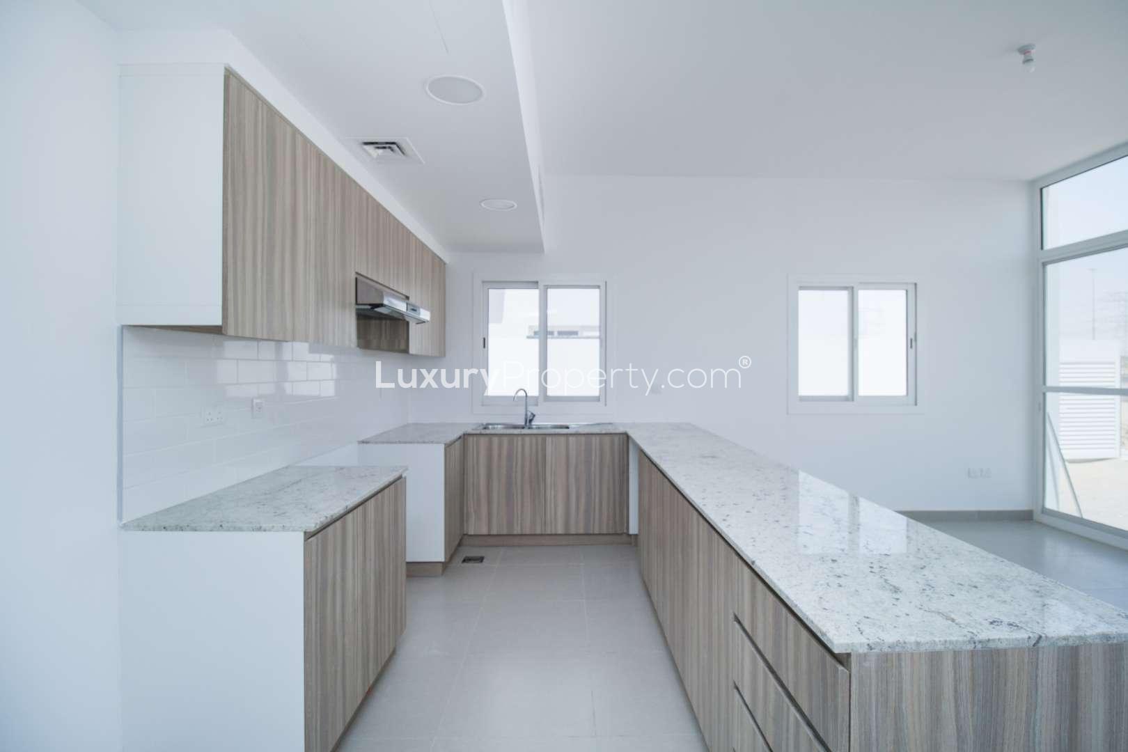 Light-filled kitchen and living area in 3-bedroom townhouse, Arabella 2, Mudon for sale