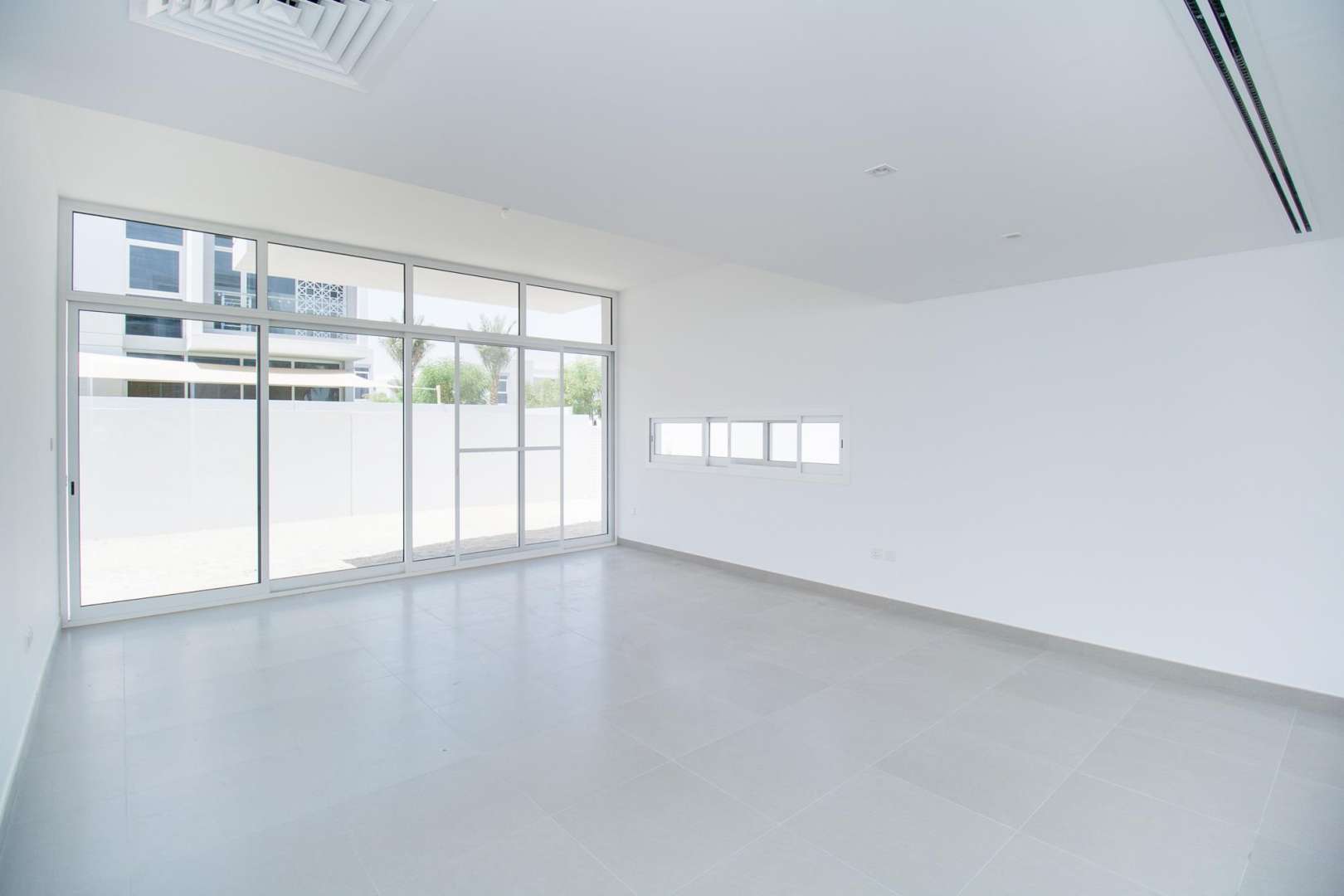 Interior of Arabella 1 townhouse in Mudon featuring staircase and bright hallway