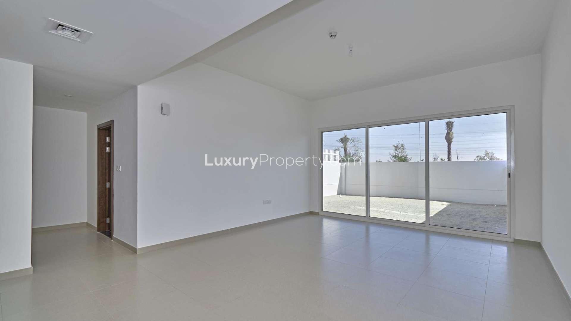 Balcony view from 3-bed villa in Arabella Townhouses, Mudon, showcasing serene surroundings