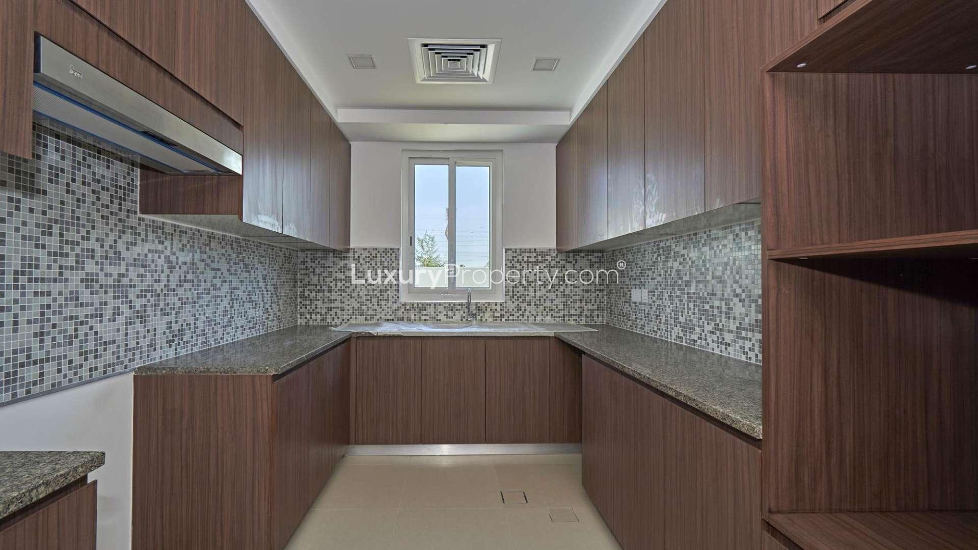 Bright living room with large windows in Arabella Townhouses, Mudon villa for sale