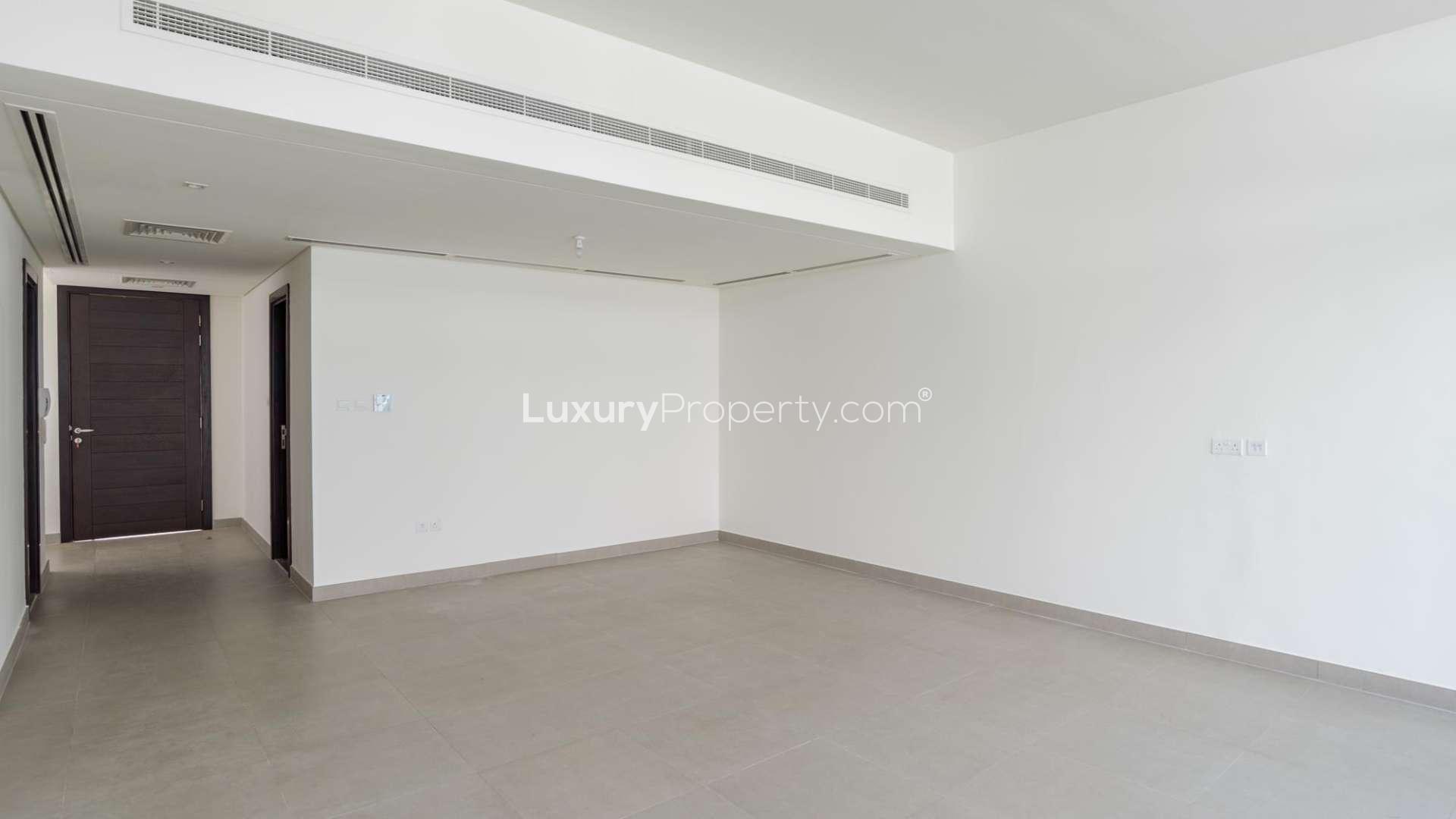 Empty living room in Arabella Townhouse, Mudon – spacious, modern design, investment opportunity