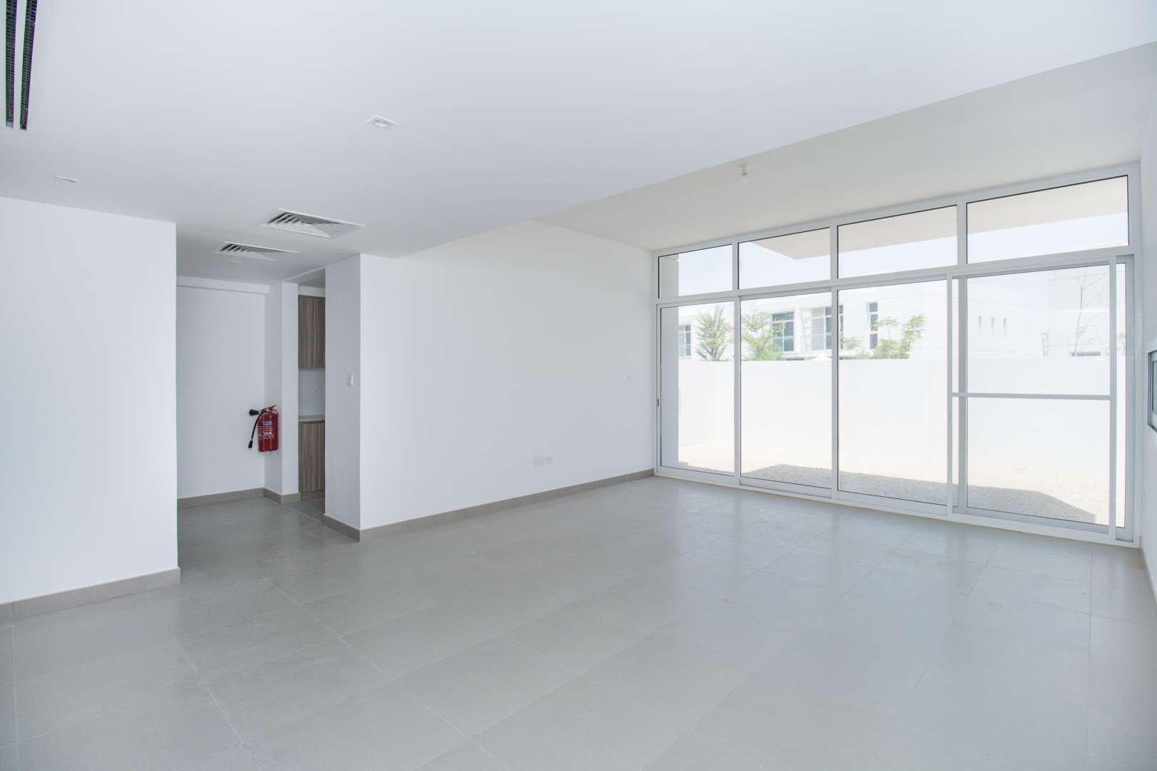 Interior view of Arabella townhouse with staircase and hallway in Mudon