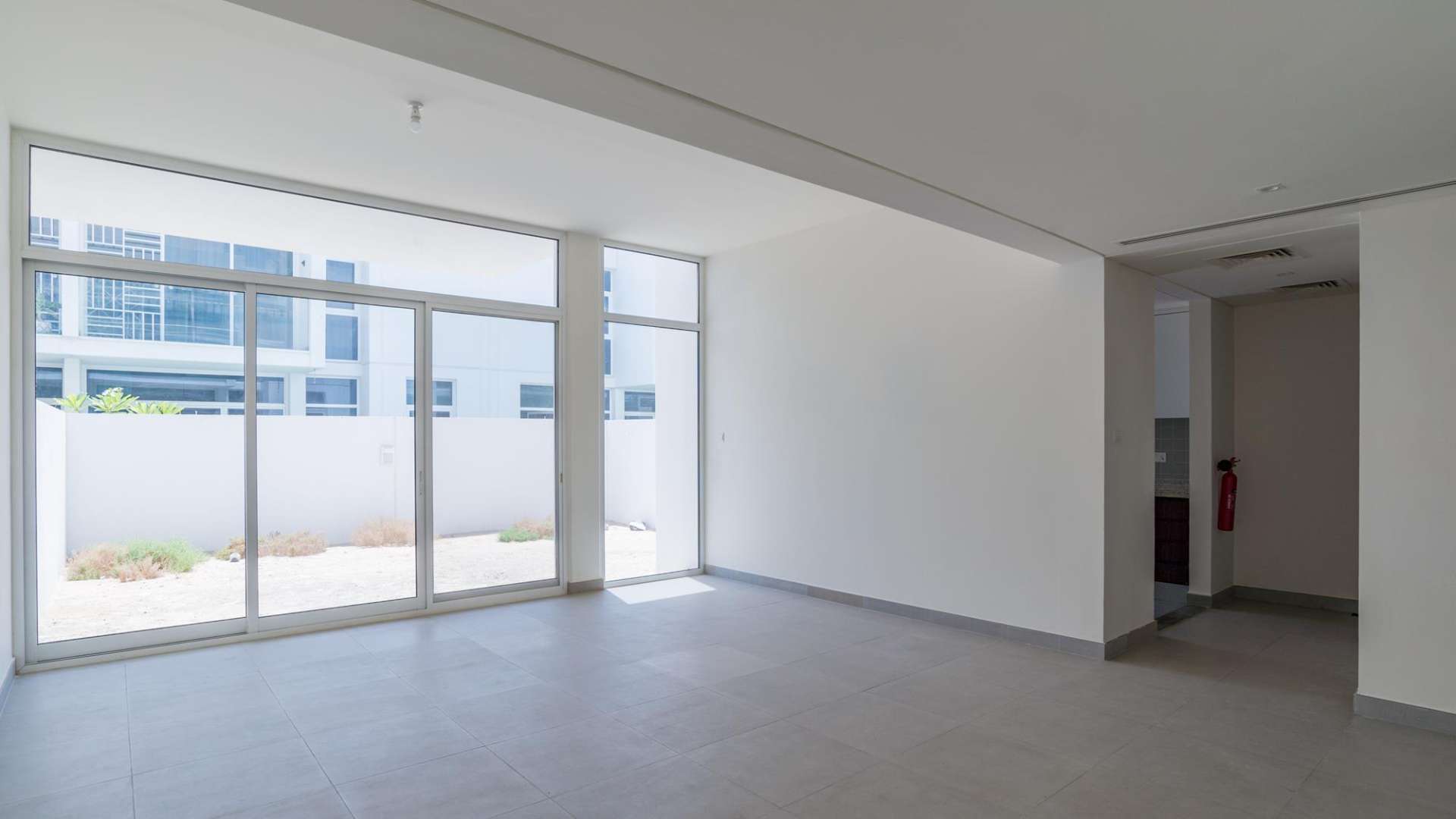 Bright living area in 3-bedroom townhouse, Arabella 1, Mudon, Dubai, with large windows