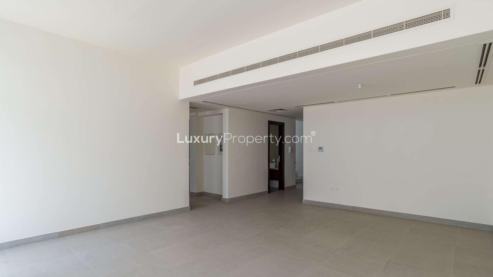 Bright living area with large windows in Arabella 1 townhouse, Mudon, Dubai