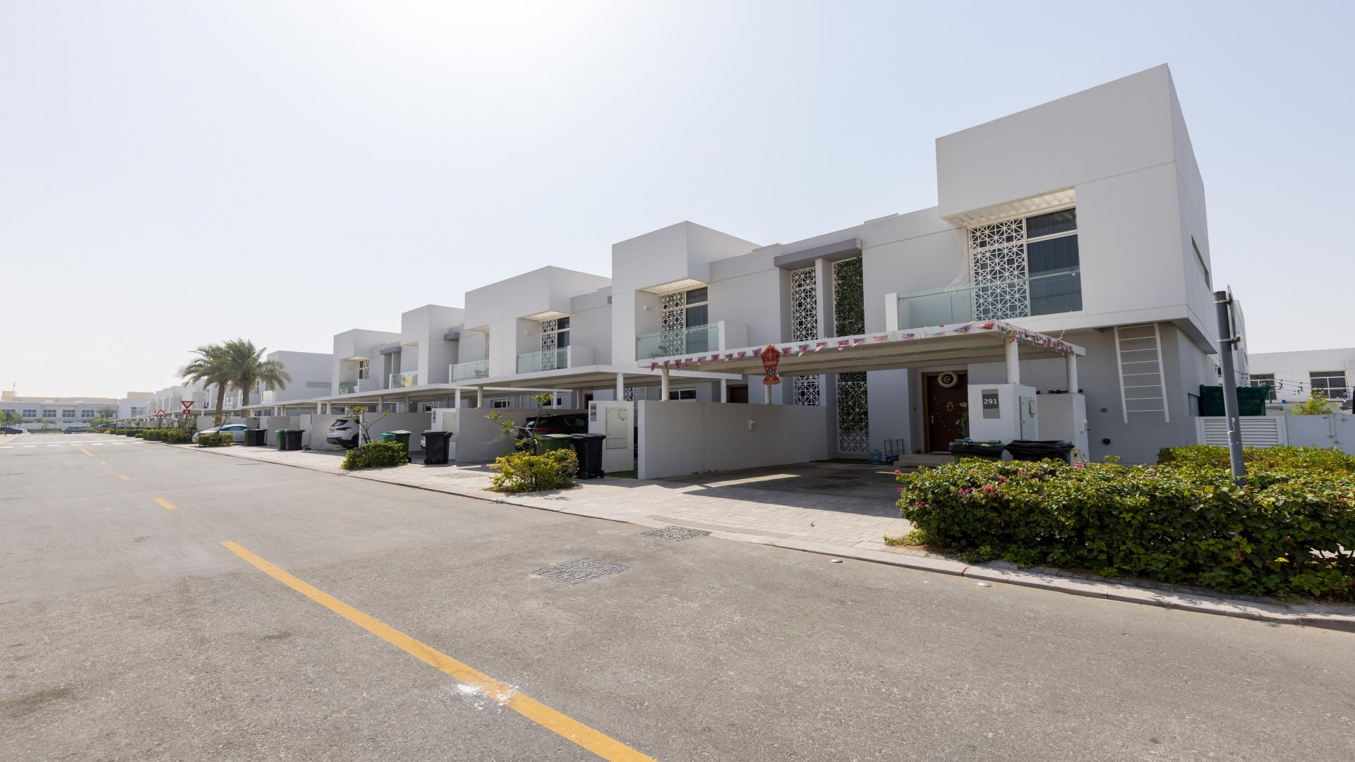 Spacious 3-bedroom townhouse exterior in Arabella, Mudon, with carport and modern design