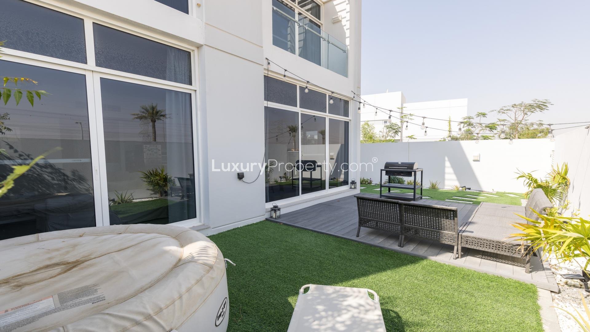 N/A,Outdoor patio of spacious 3-bedroom townhouse in Arabella, Mudon with seating and grill
