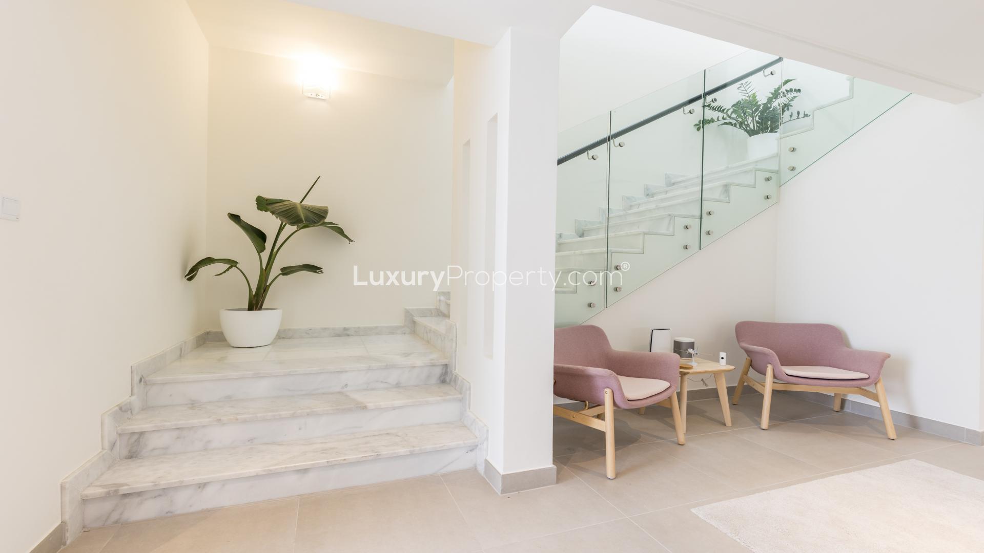 Balcony view of lush gardens in Arabella, Mudon Community townhouse for sale