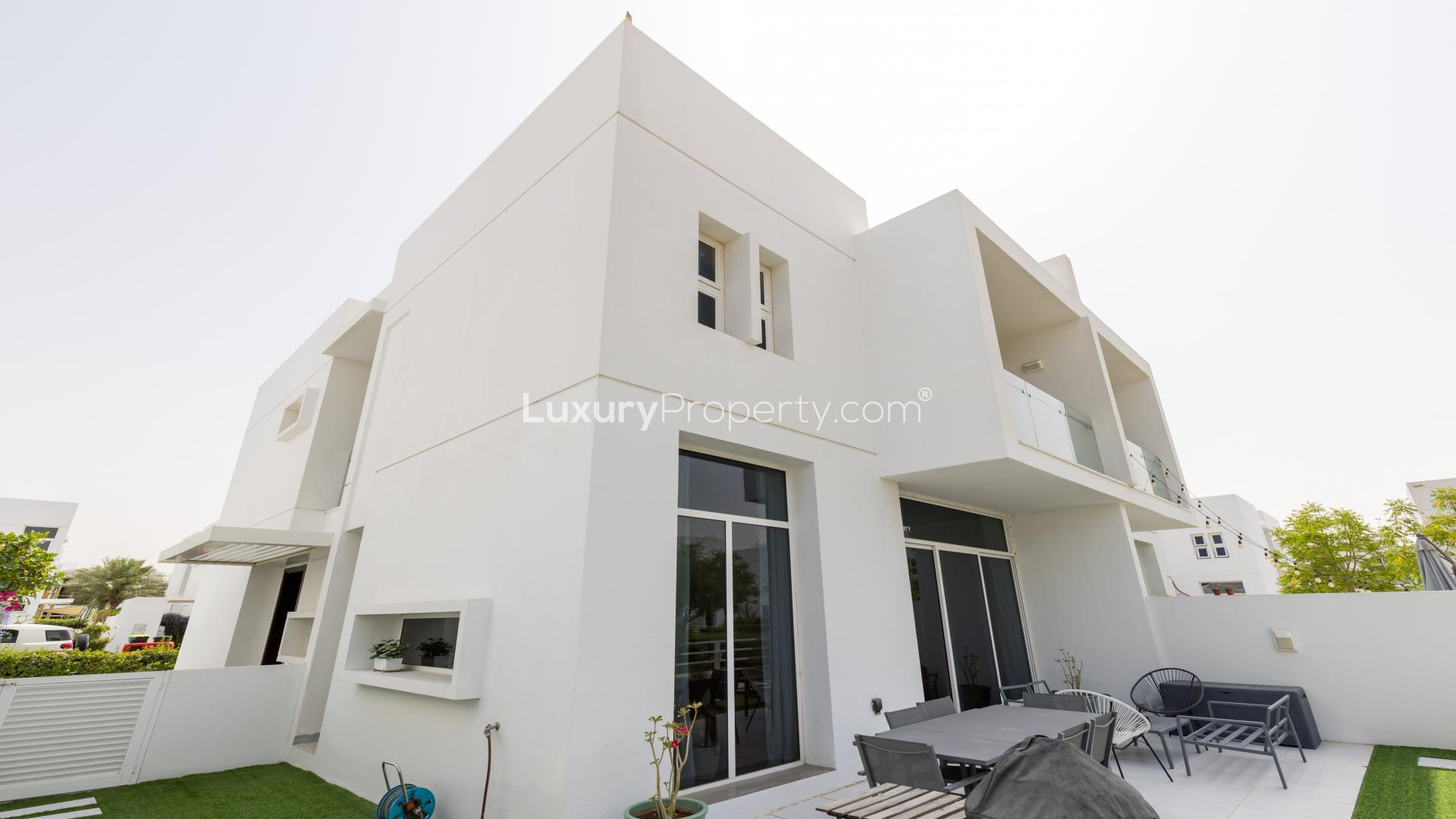 Living room in Mudon Arabella townhouse with modern decor and large windows