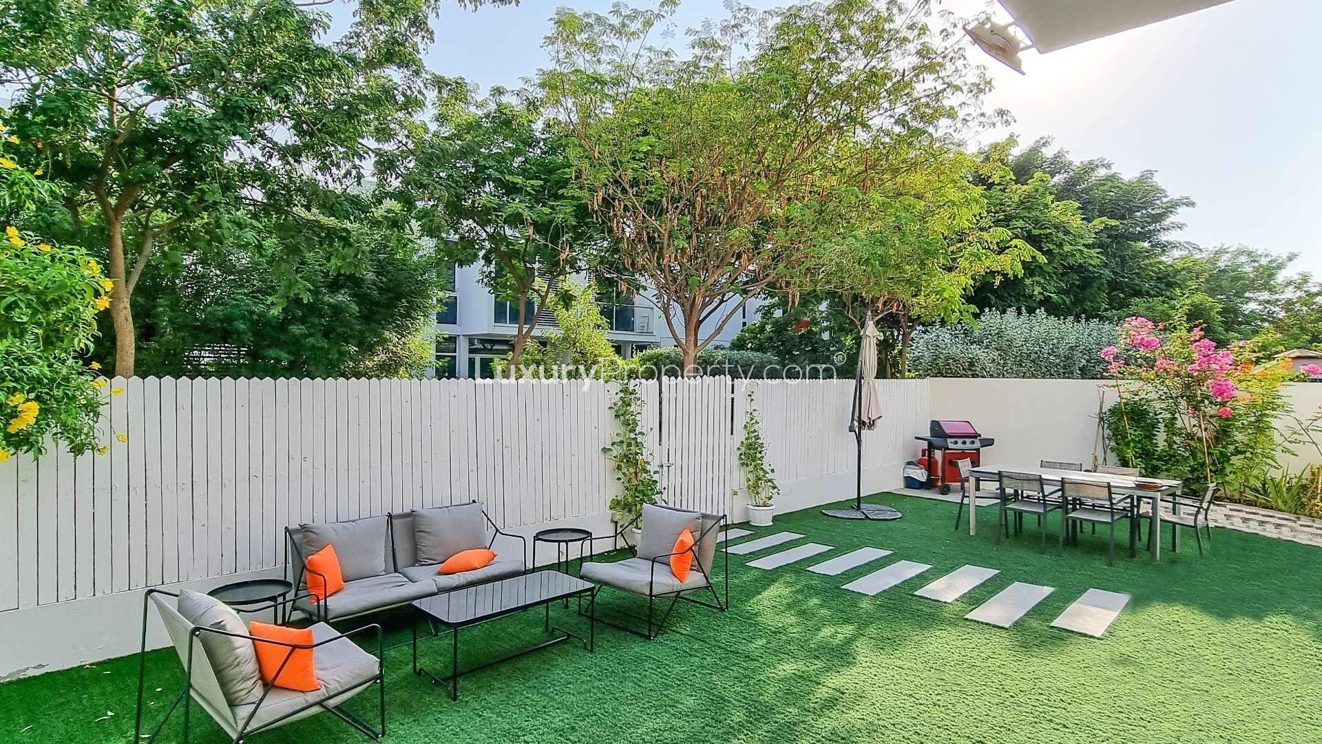Modern Arabella Townhouse garden with vibrant flowers, Mudon community, Dubai