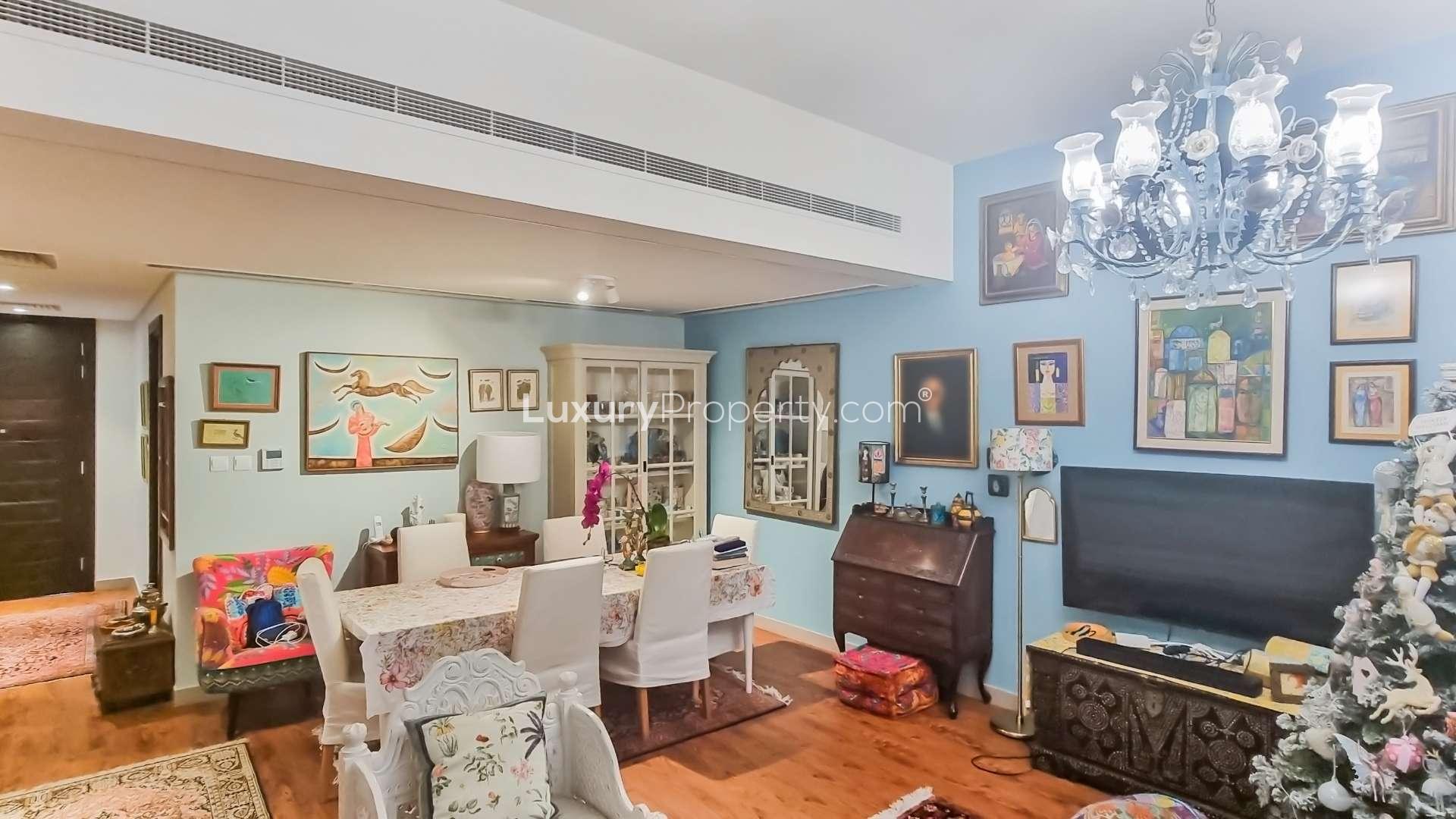 Charming Mudon townhouse garden with patio, seating area, and lush greenery in Arabella