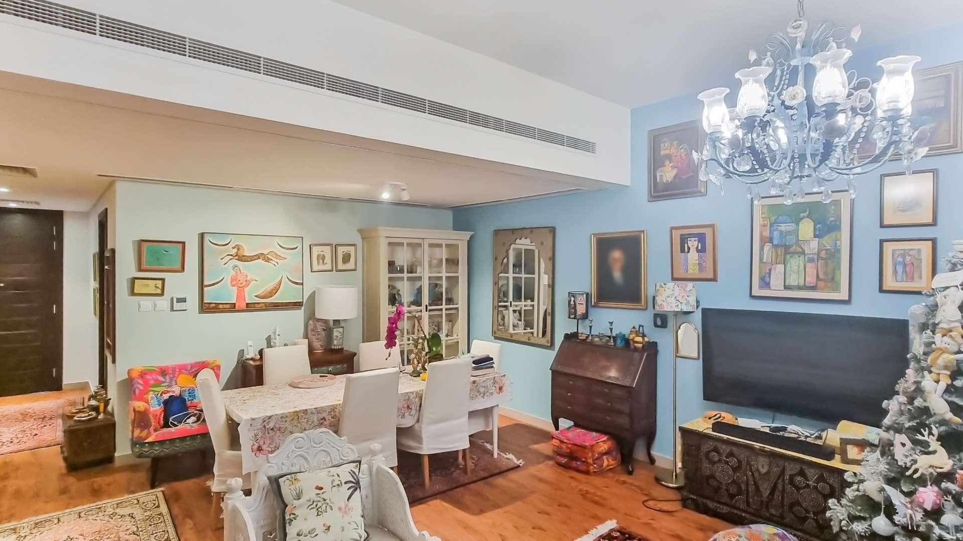 Charming Mudon townhouse garden with patio, seating area, and lush greenery in Arabella